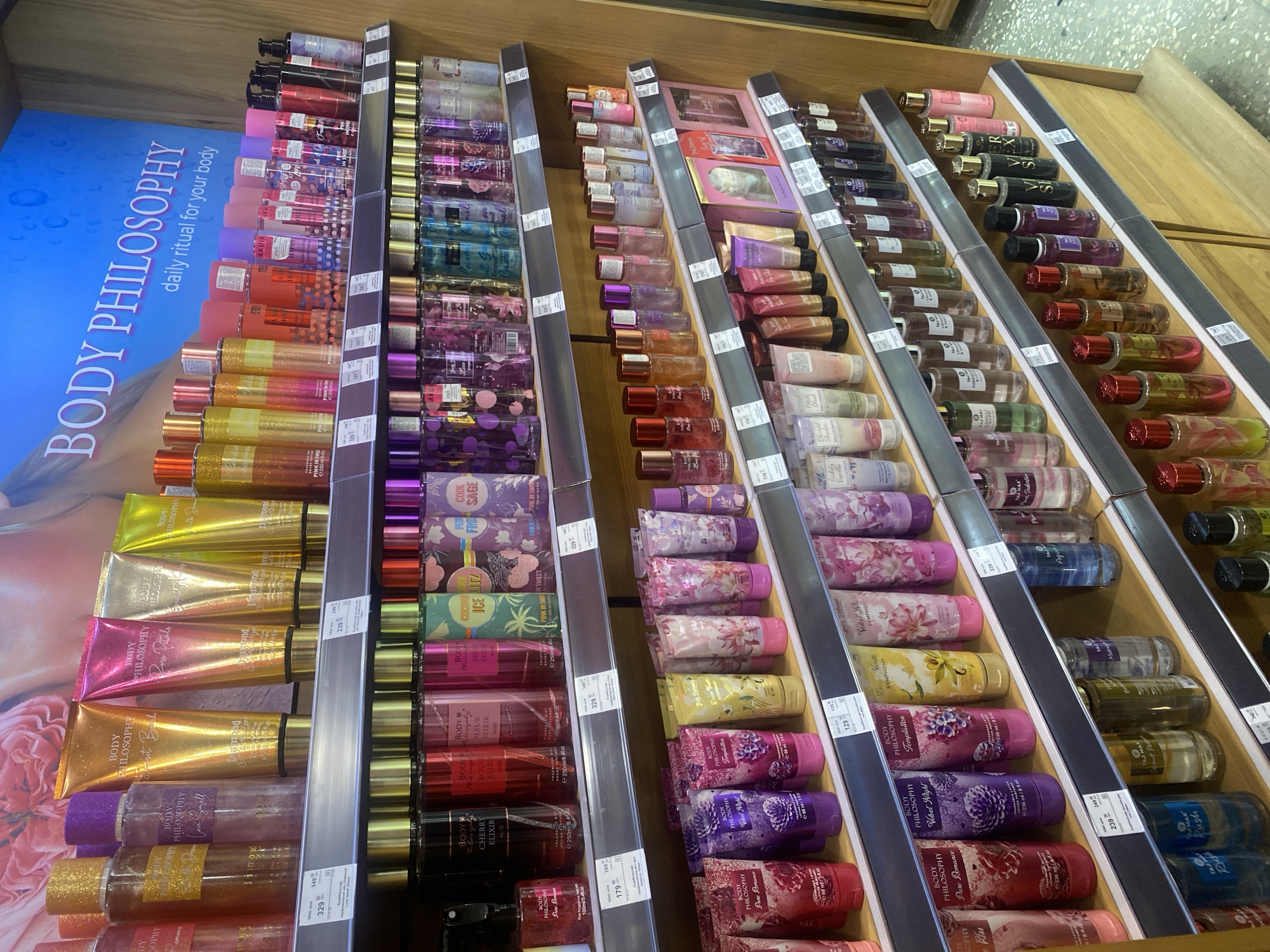 Beauty store shelves stocked with skincare and lip products