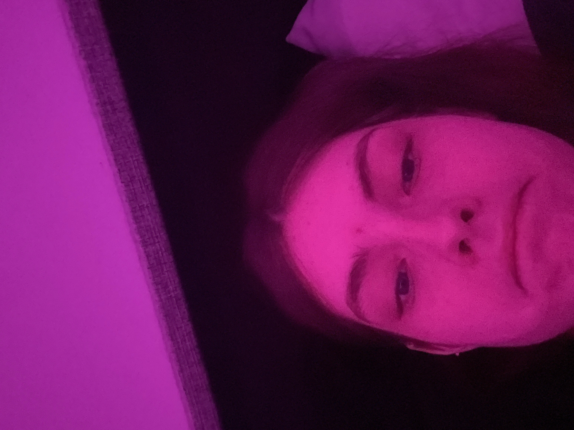 Person photographed with colored lighting in Saint Petersburg apartment