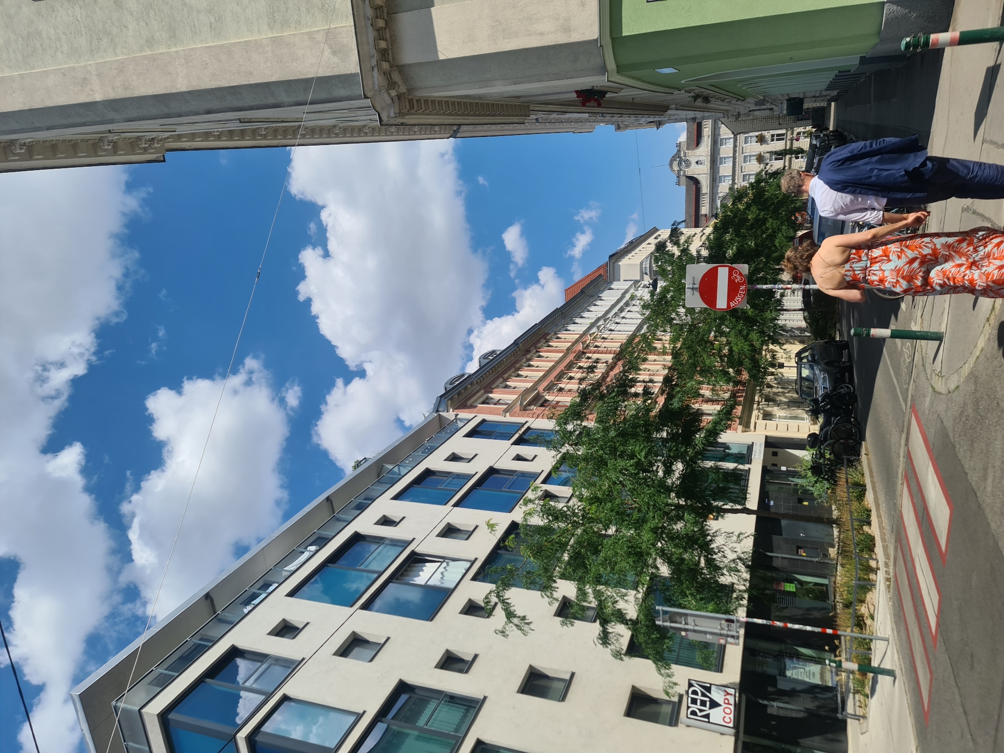 Street-level Vienna: facades, foot traffic, and a sunny afternoon