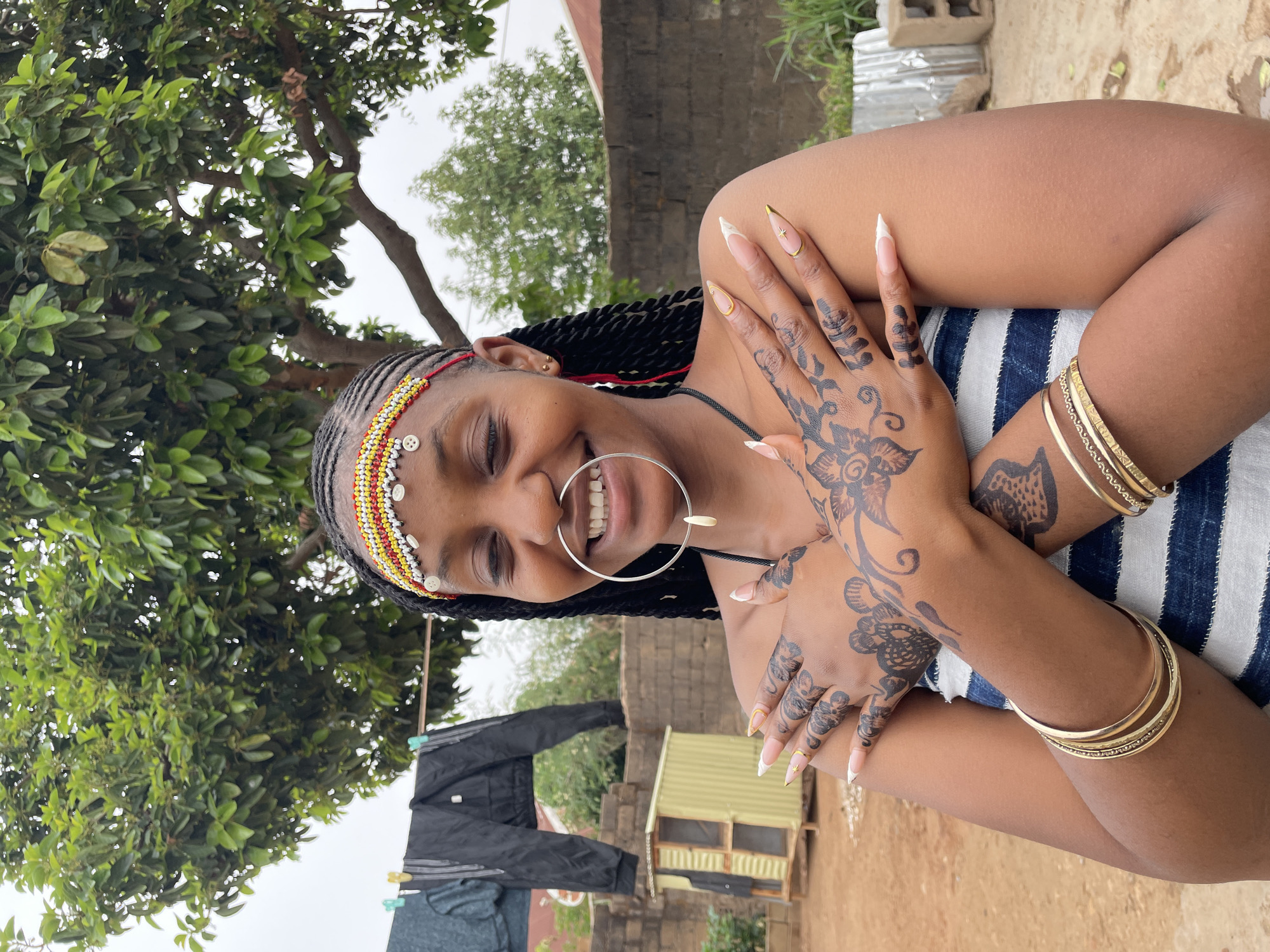 Woman photographed in traditional jewelry during outdoor portrait session