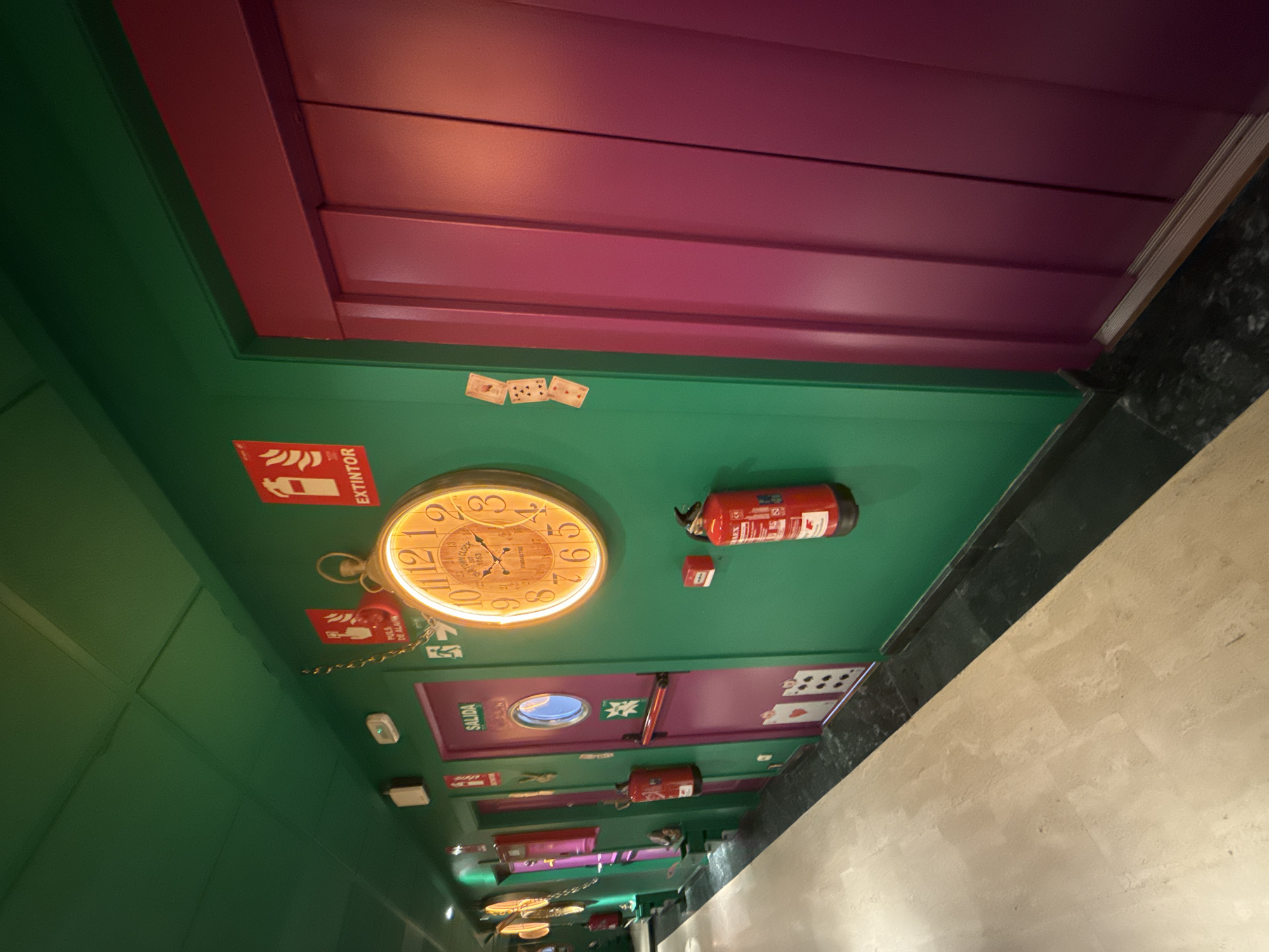 Woman takes selfies in colorful Madrid rooms