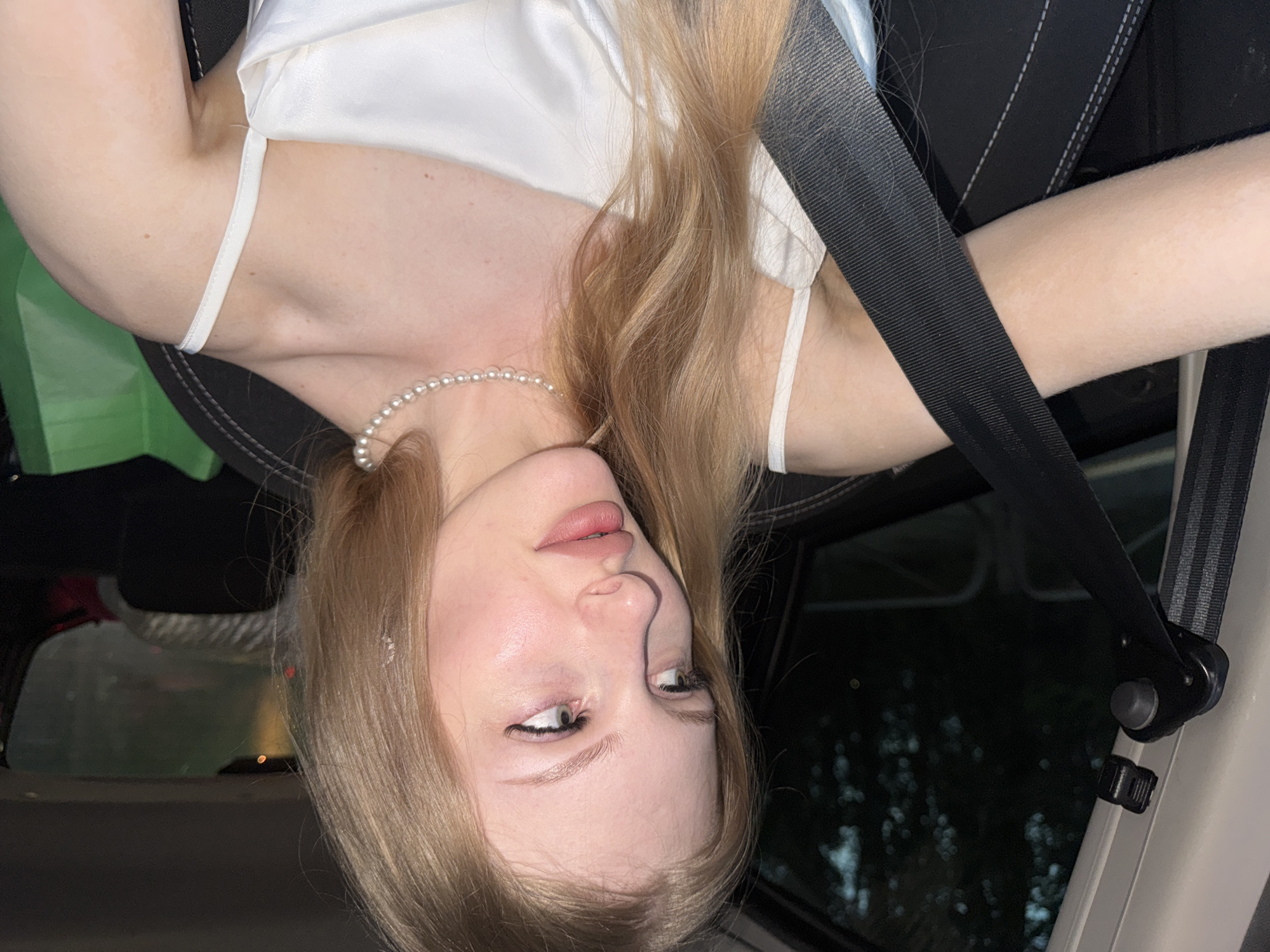 Evening car ride in Perm, white satin and pearls