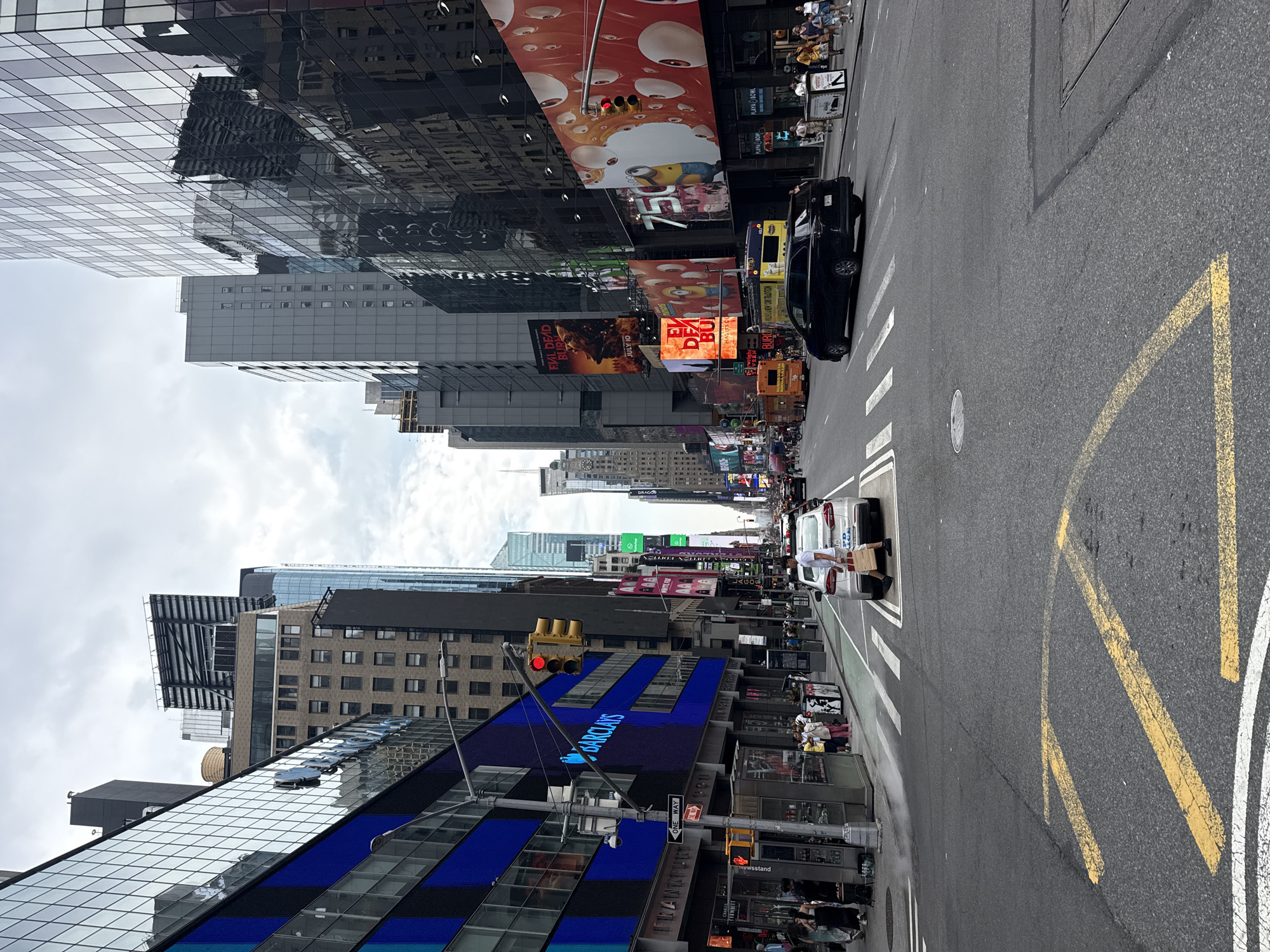 Midtown Manhattan crowds and landmarks on a July evening