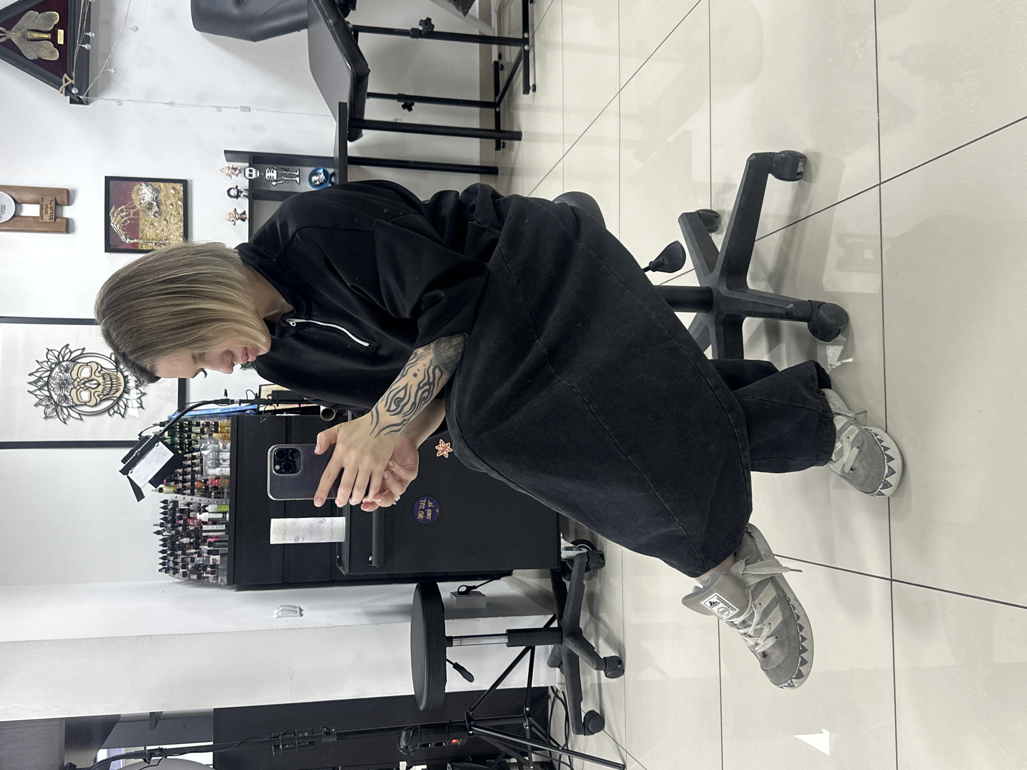 Woman documents tattoo studio visit with selfies in Rostov-on-Don