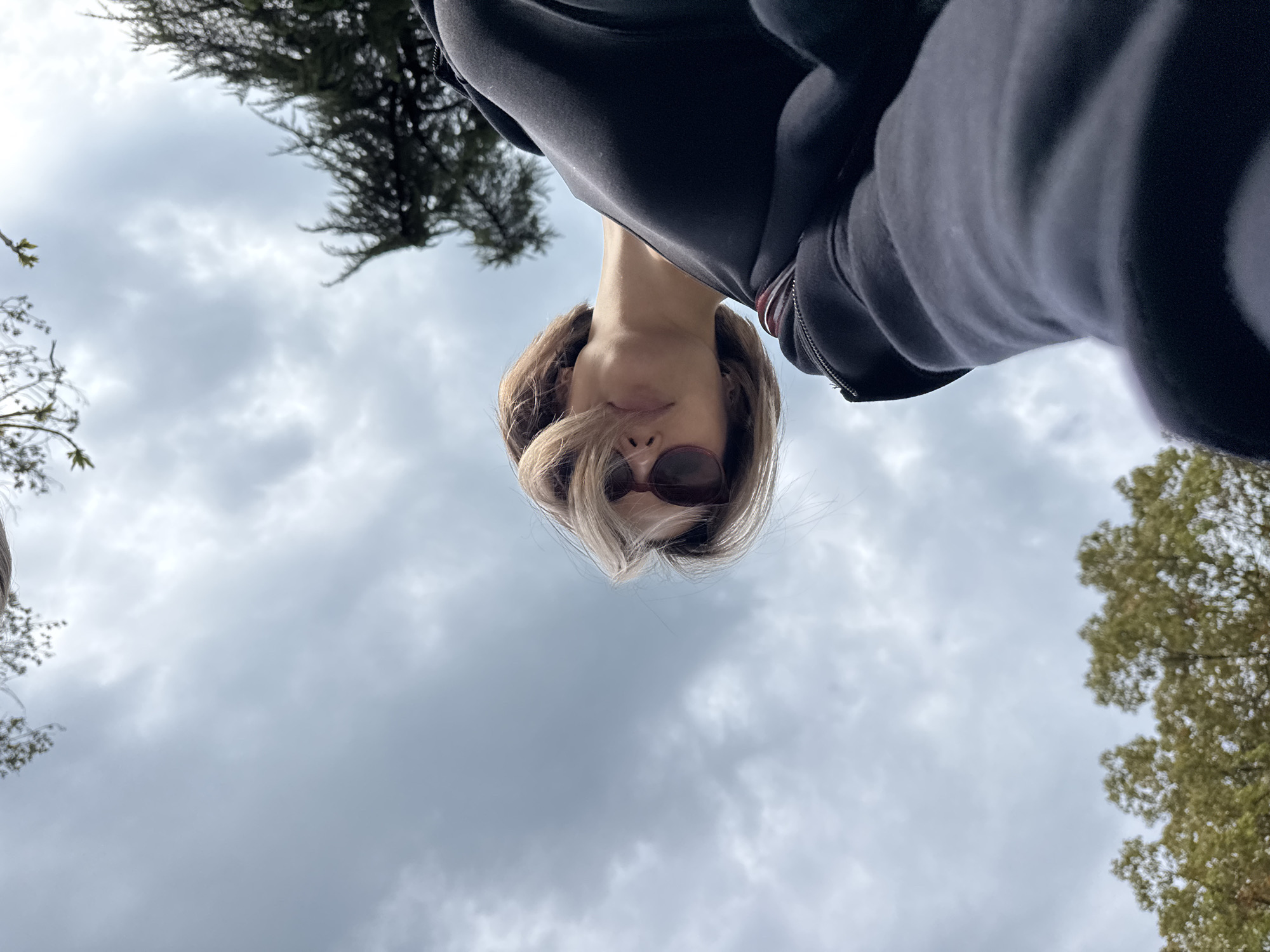 Woman documents park visit with selfies, bamboo forests, wildlife