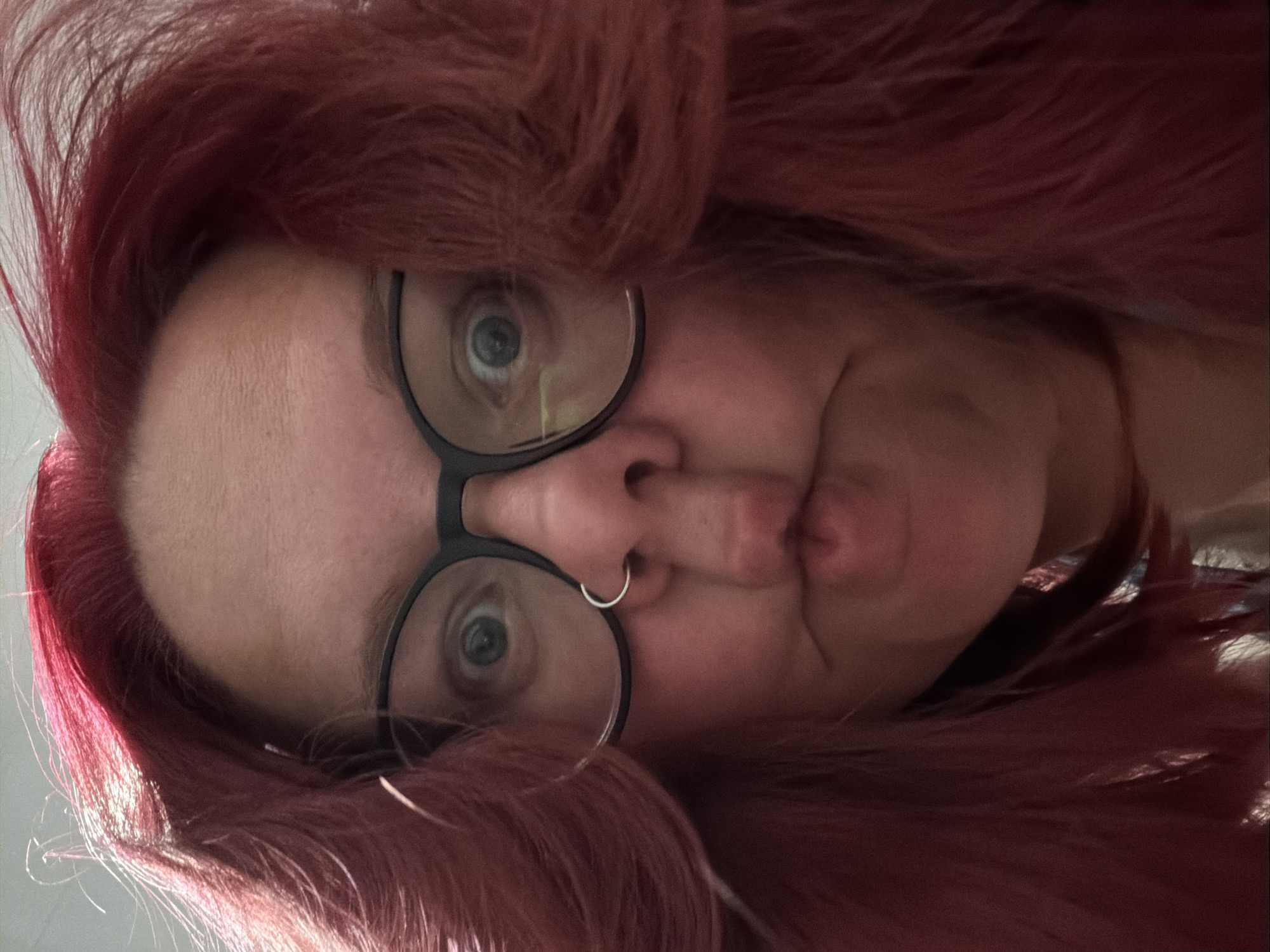 Portrait captured in Chaikovsky shows red-haired individual with glasses
