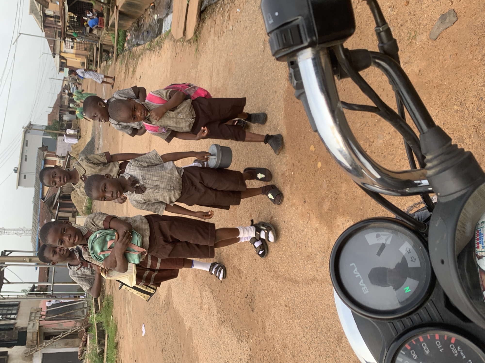 Morning commute on foot through Shagamu's unpaved streets