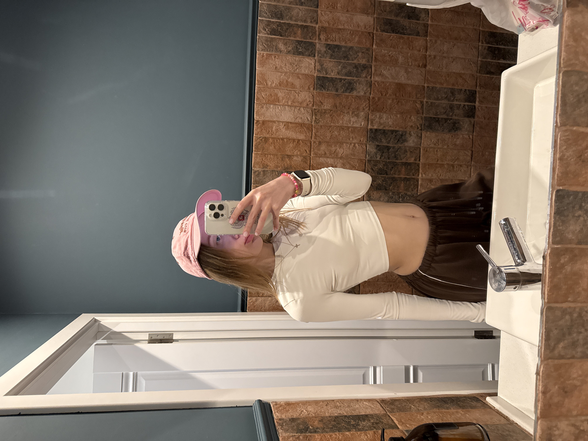 Young person takes bathroom mirror selfie in Rostov-on-Don