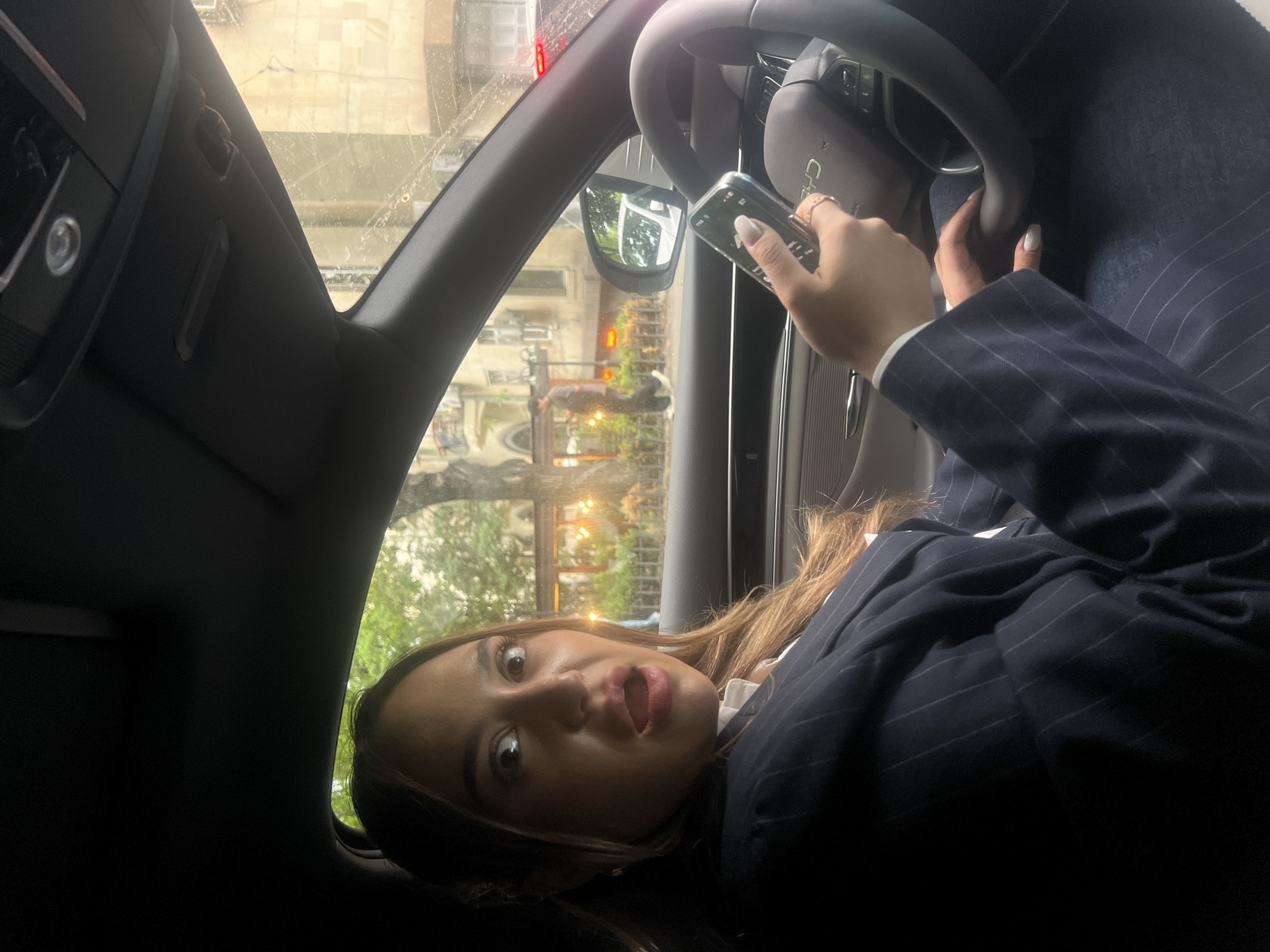 Everyday moments captured across Yerevan featuring women, cars, smartphones