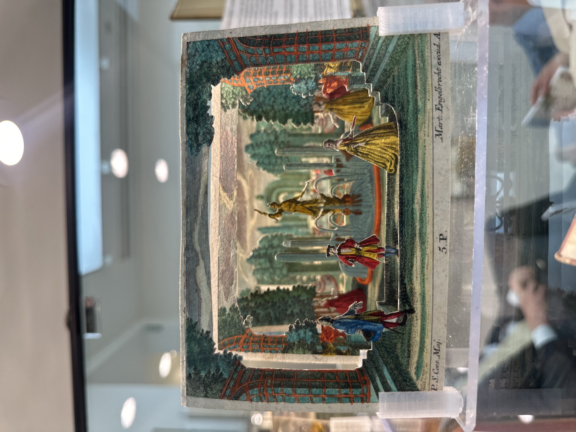 Visitor documents vintage displays at London rare book fair