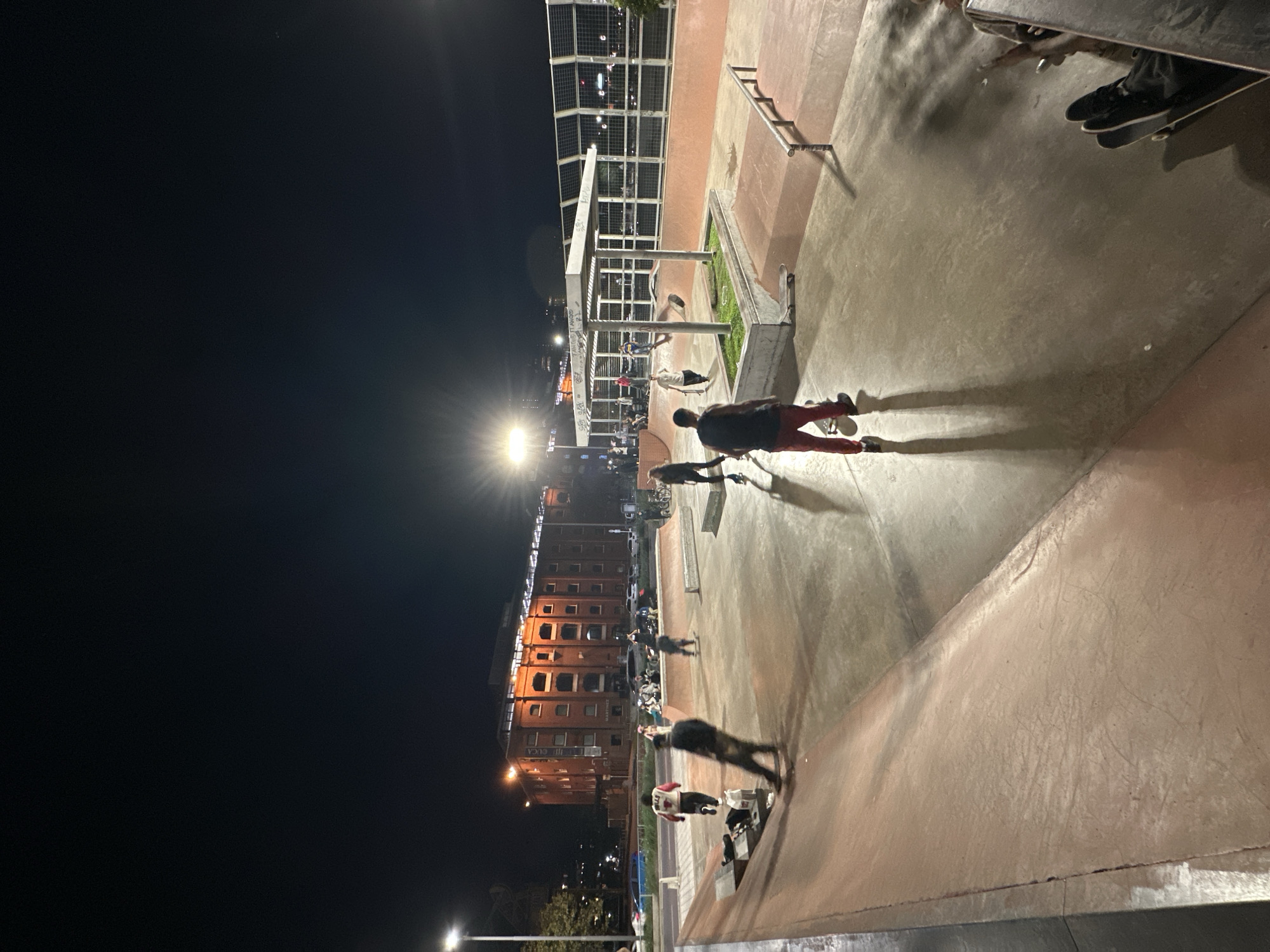 Night skateboarding session observed at Buenos Aires skate park