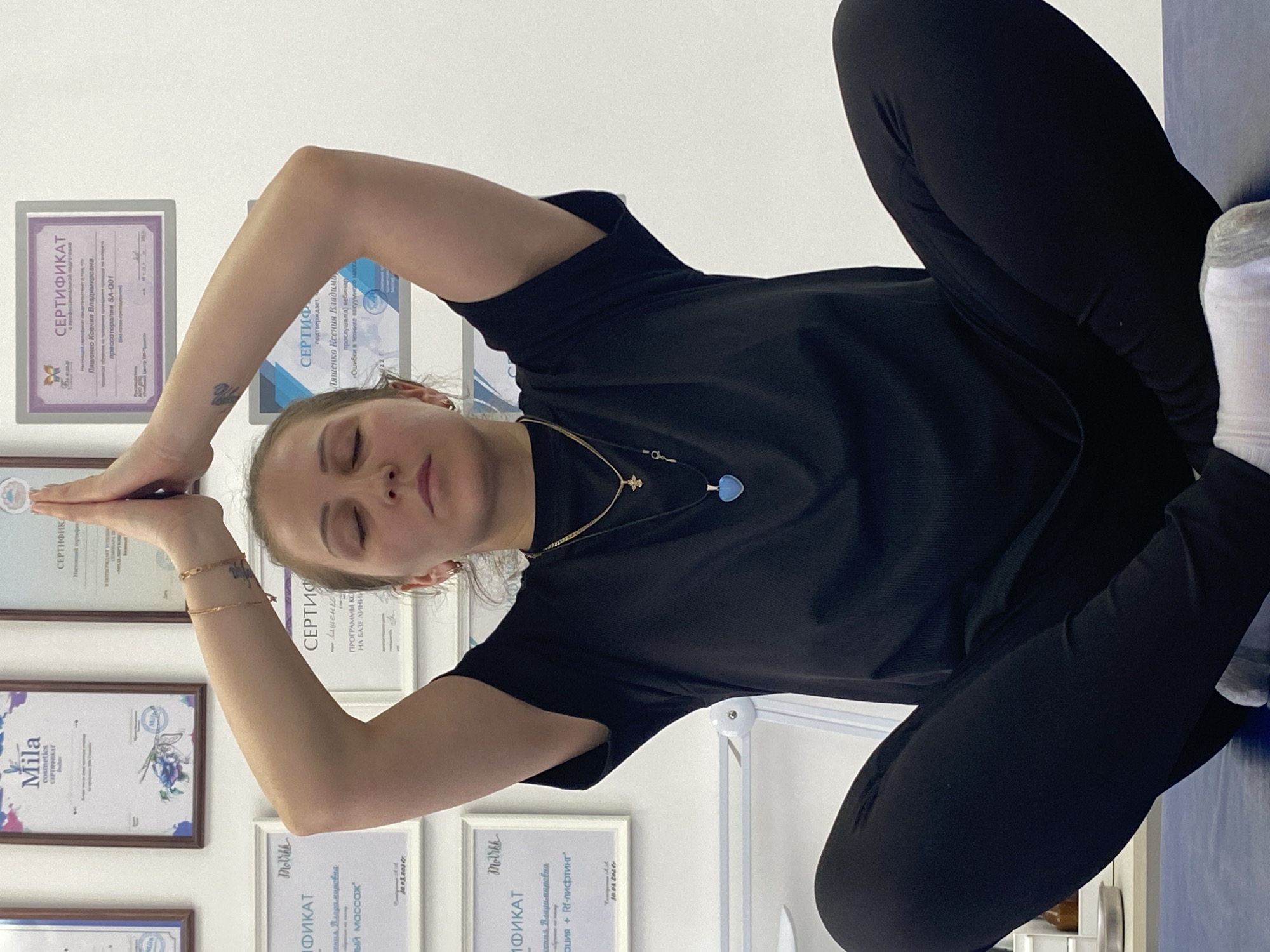 Woman practices yoga pose in Марковский, Russia