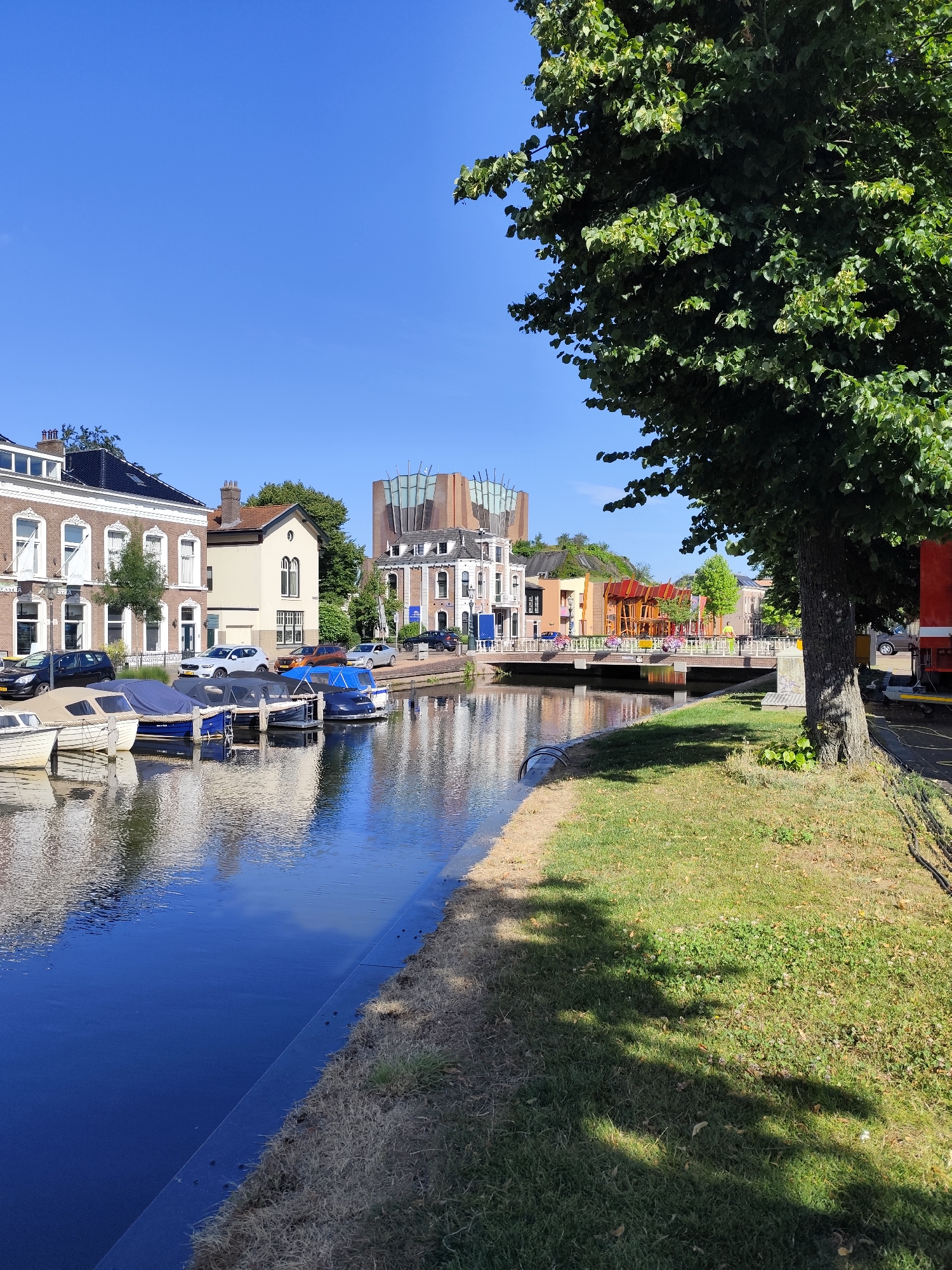 Sneek canal on a sunny morning, boats moored along the waterway