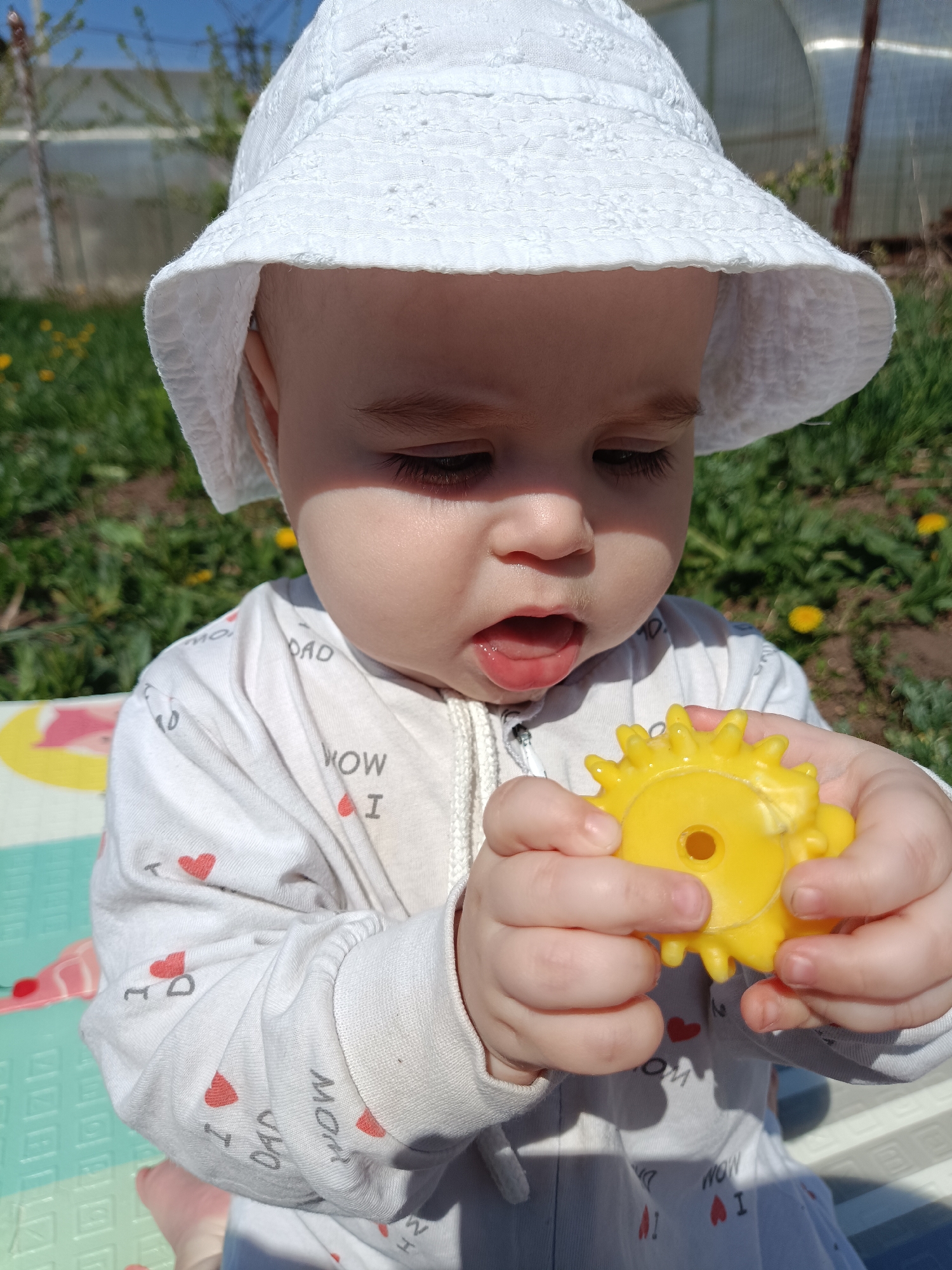 Baby in heart-print outfit spotted outdoors in Chaikovsky, Russia