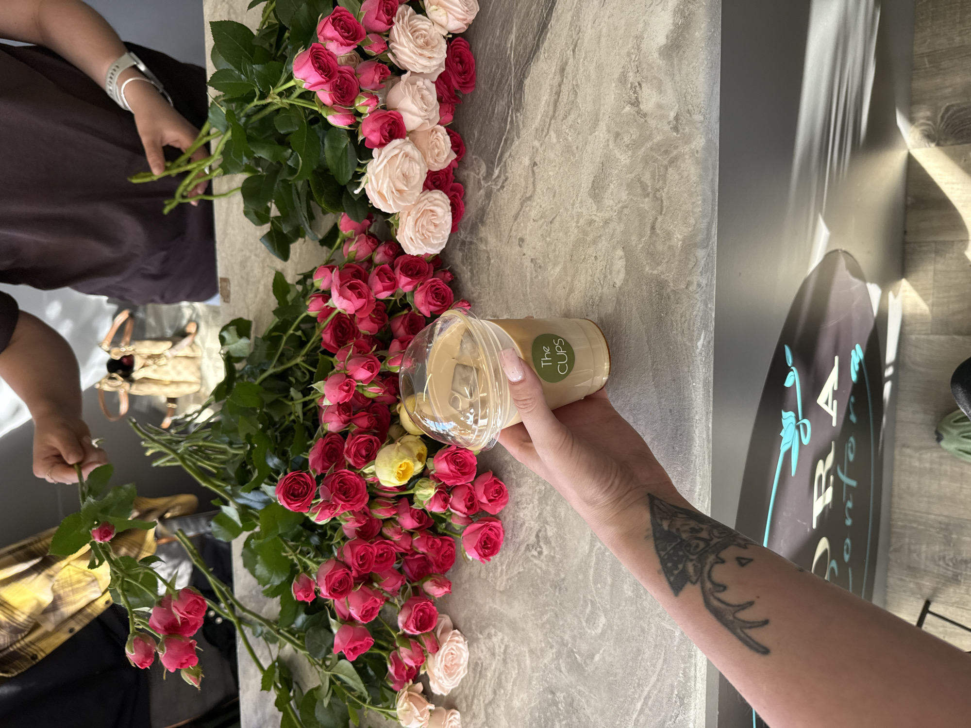 Flower shop visit with bouquets, ribbons, and iced coffee