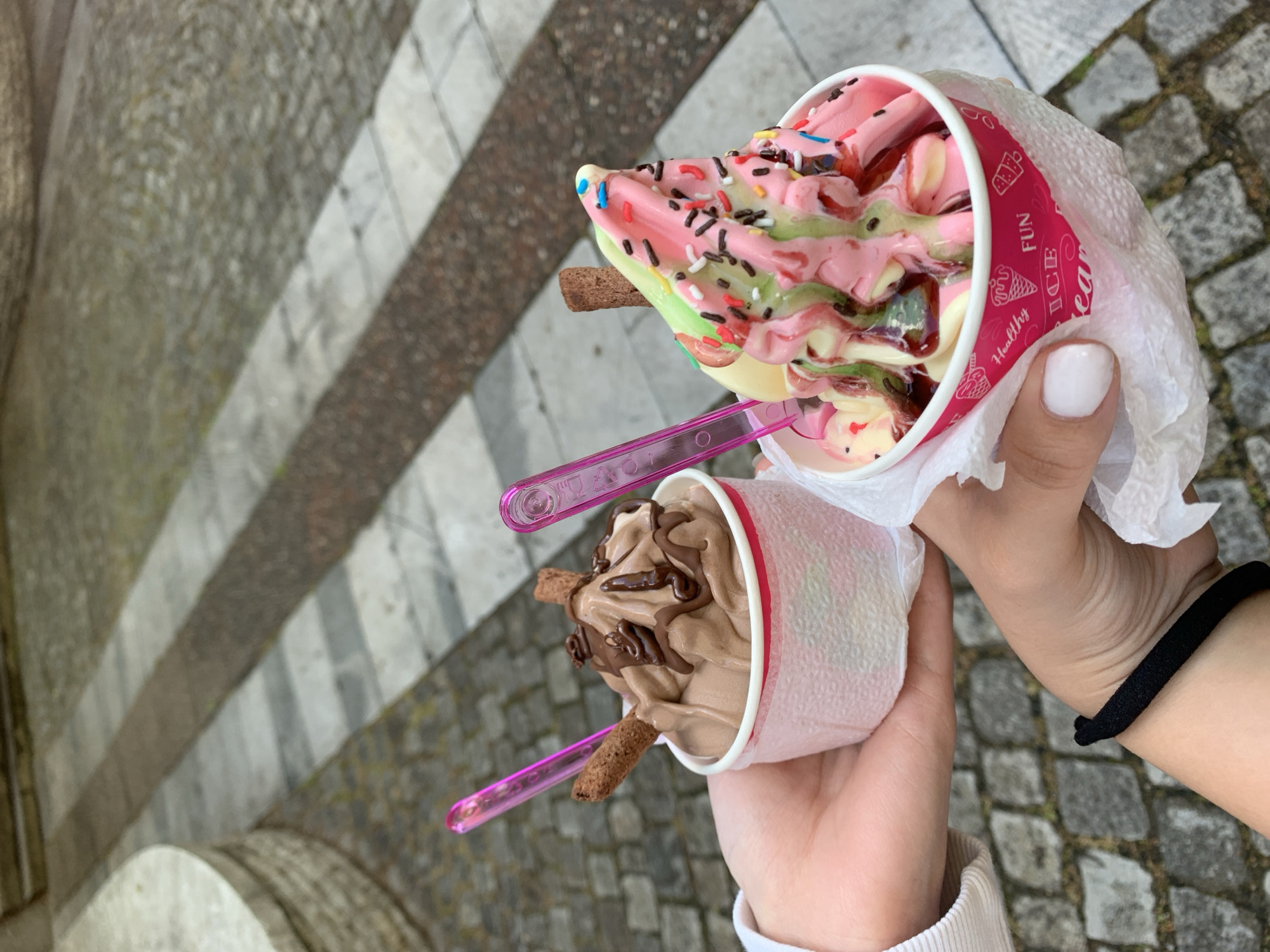 Ice cream shared on cobblestone street in Kyustendil, Bulgaria