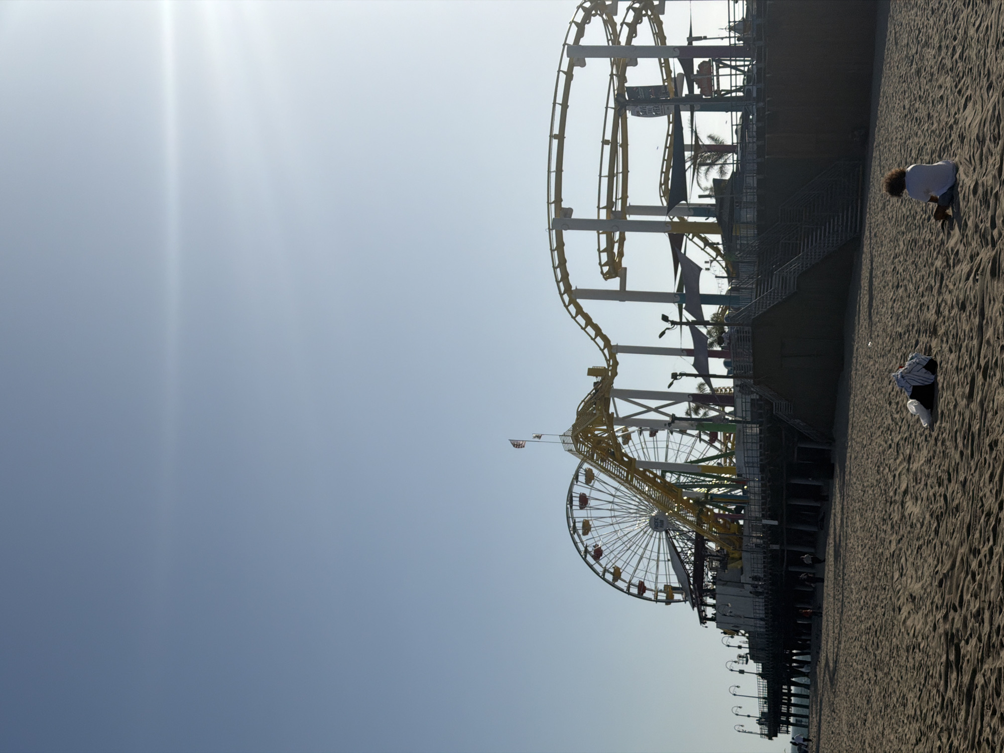 Santa Monica Pier photographed showing Ferris wheel, roller coaster