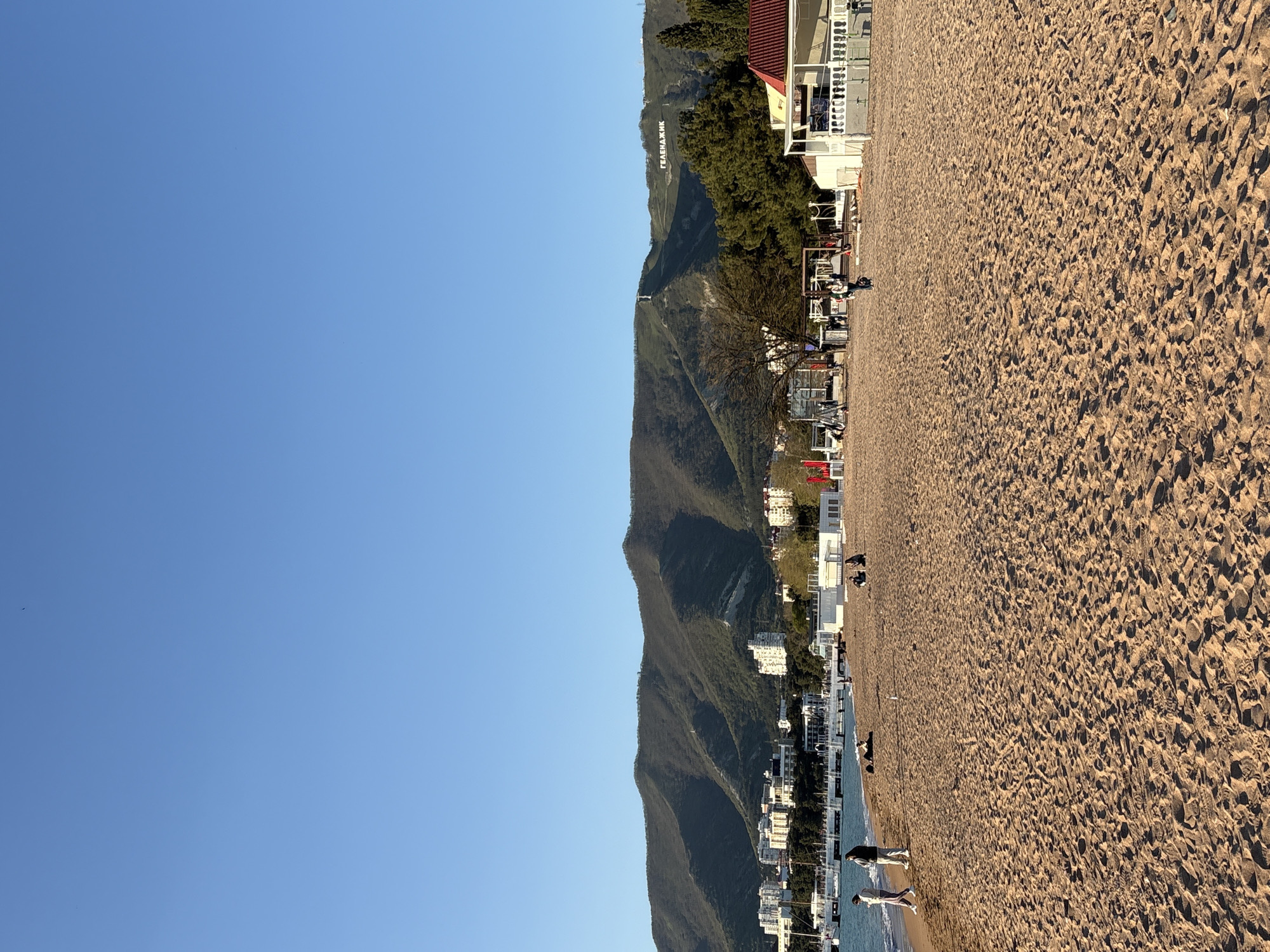 Visitor documents sunset beach experience in Gelendzhik, Russia
