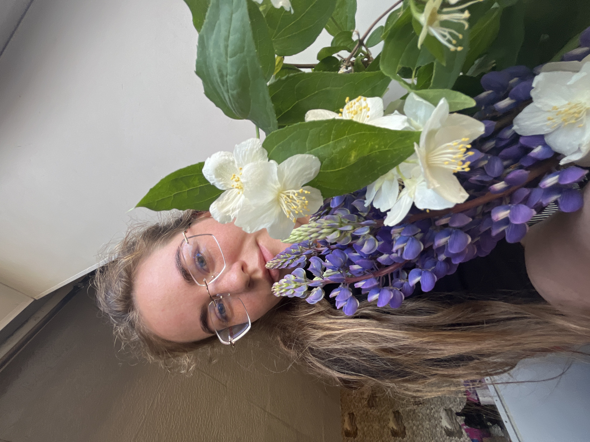 Woman documents morning nature walk with wildflower photography in Russia