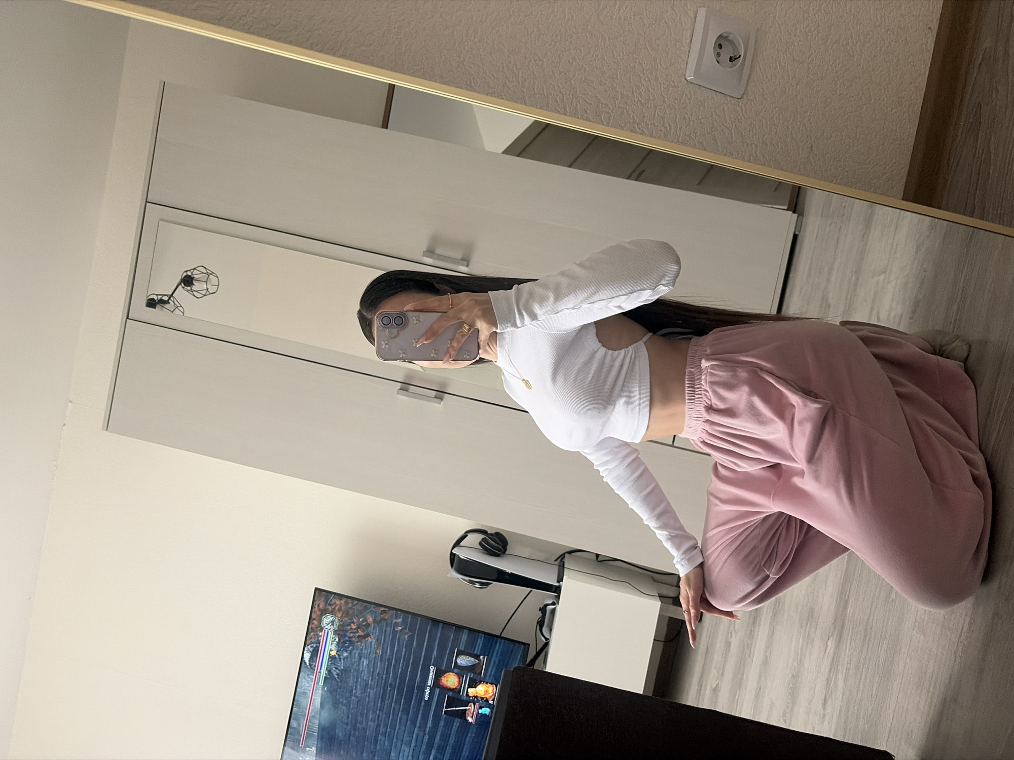 Woman takes mirror selfies in Saint Petersburg gaming room
