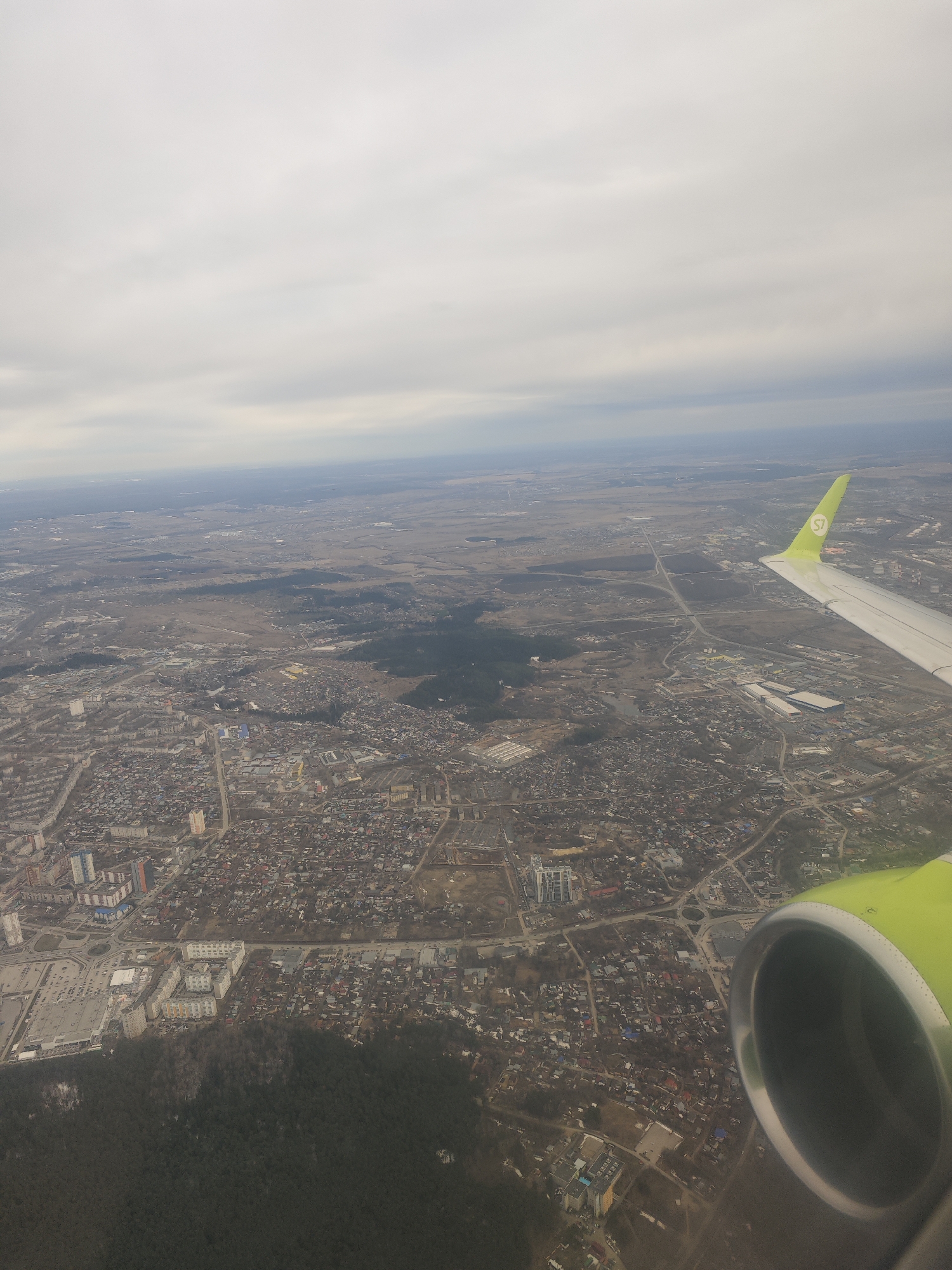 S7 passenger documents aerial views of Novosibirsk during flight