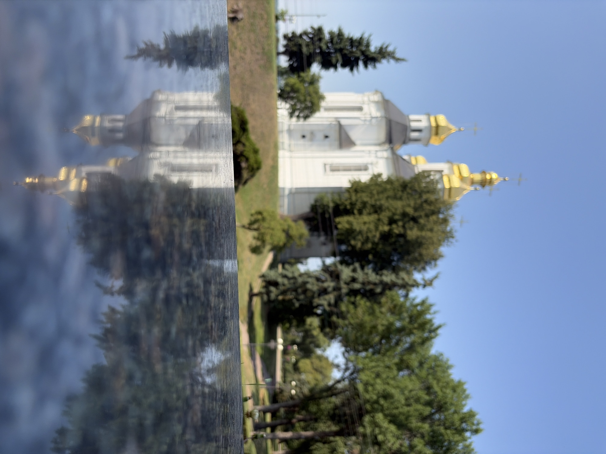 Orthodox church with golden domes explored on a sunny summer morning