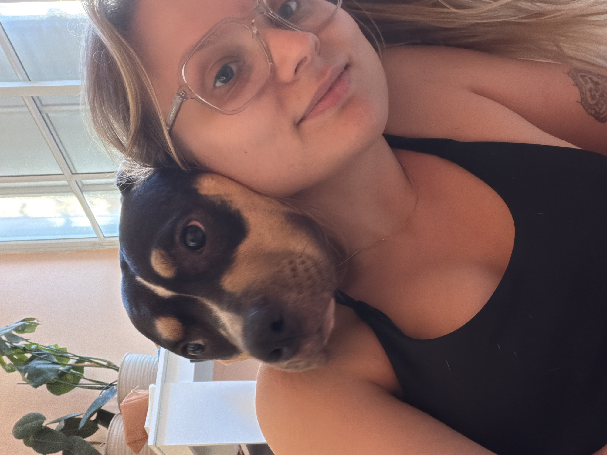 Woman and tri-colored dog photographed together in Tel-Aviv