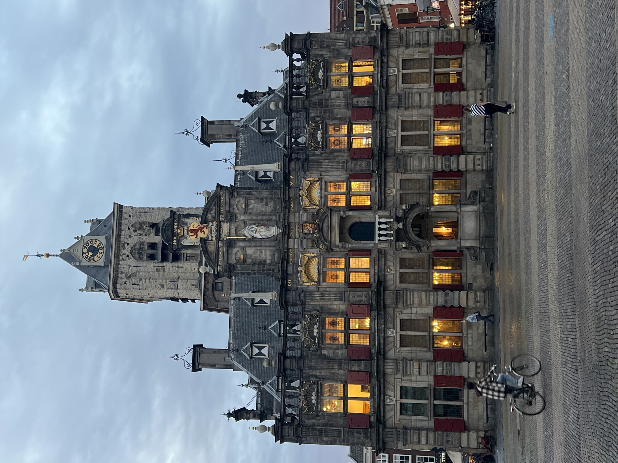 Delft's Markt square at dusk, City Hall and Oude Kerk