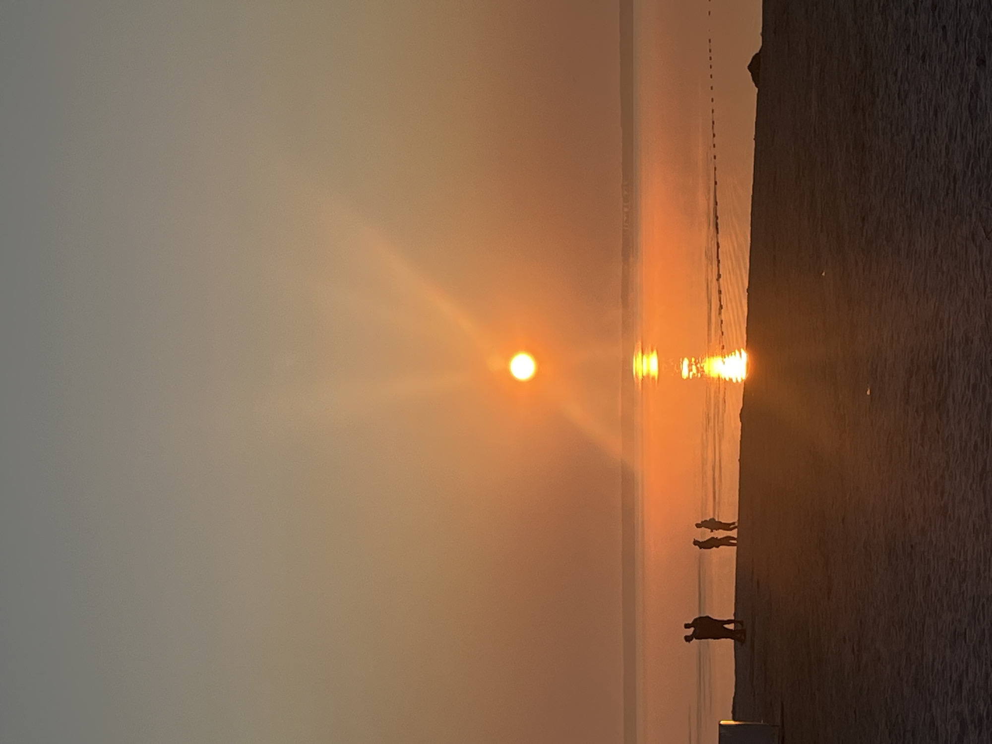 Golden sunset over the water at Surakovo beach