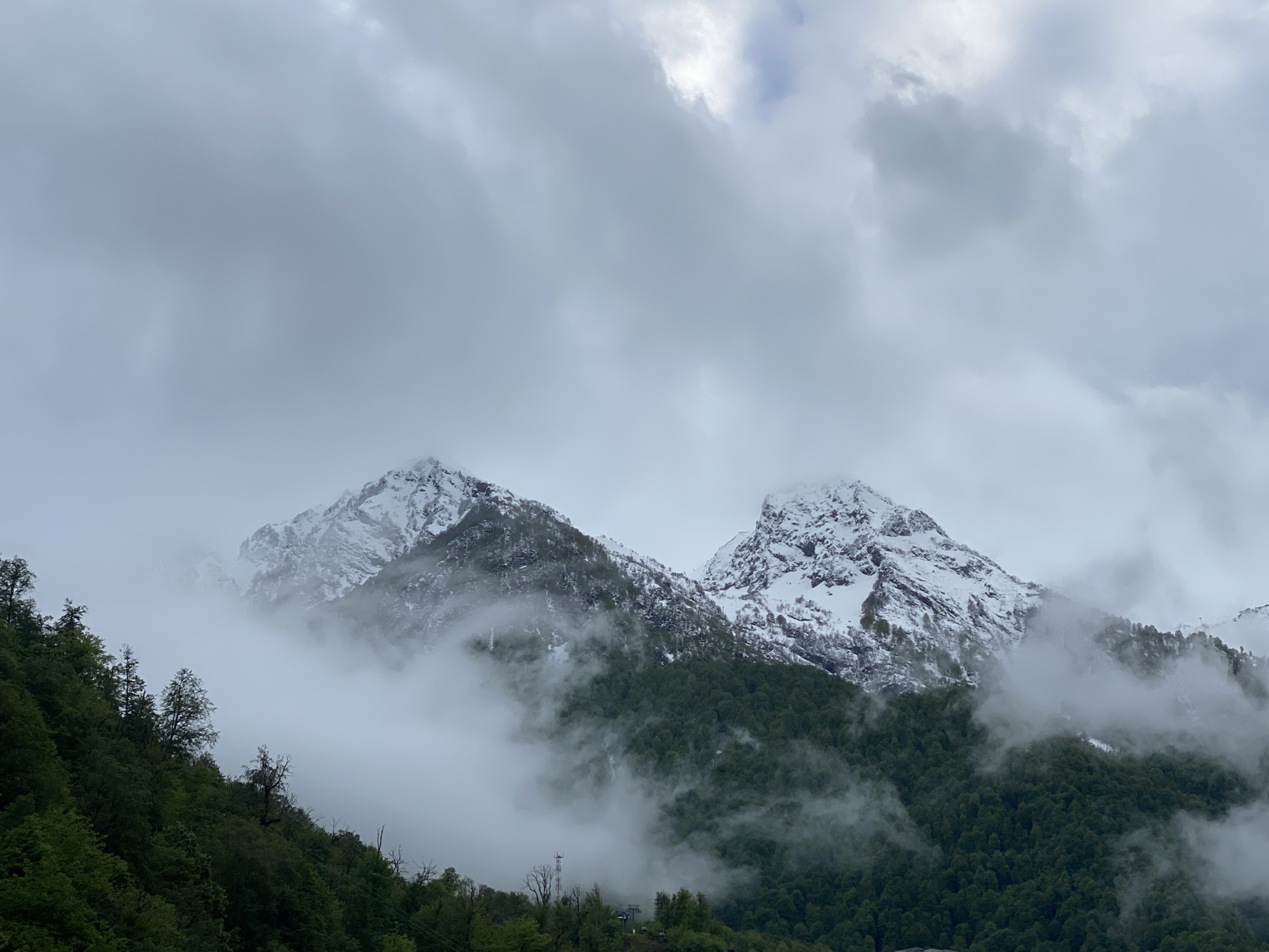 Foggy conditions observed over snow-capped mountains in Estosadok, Russia