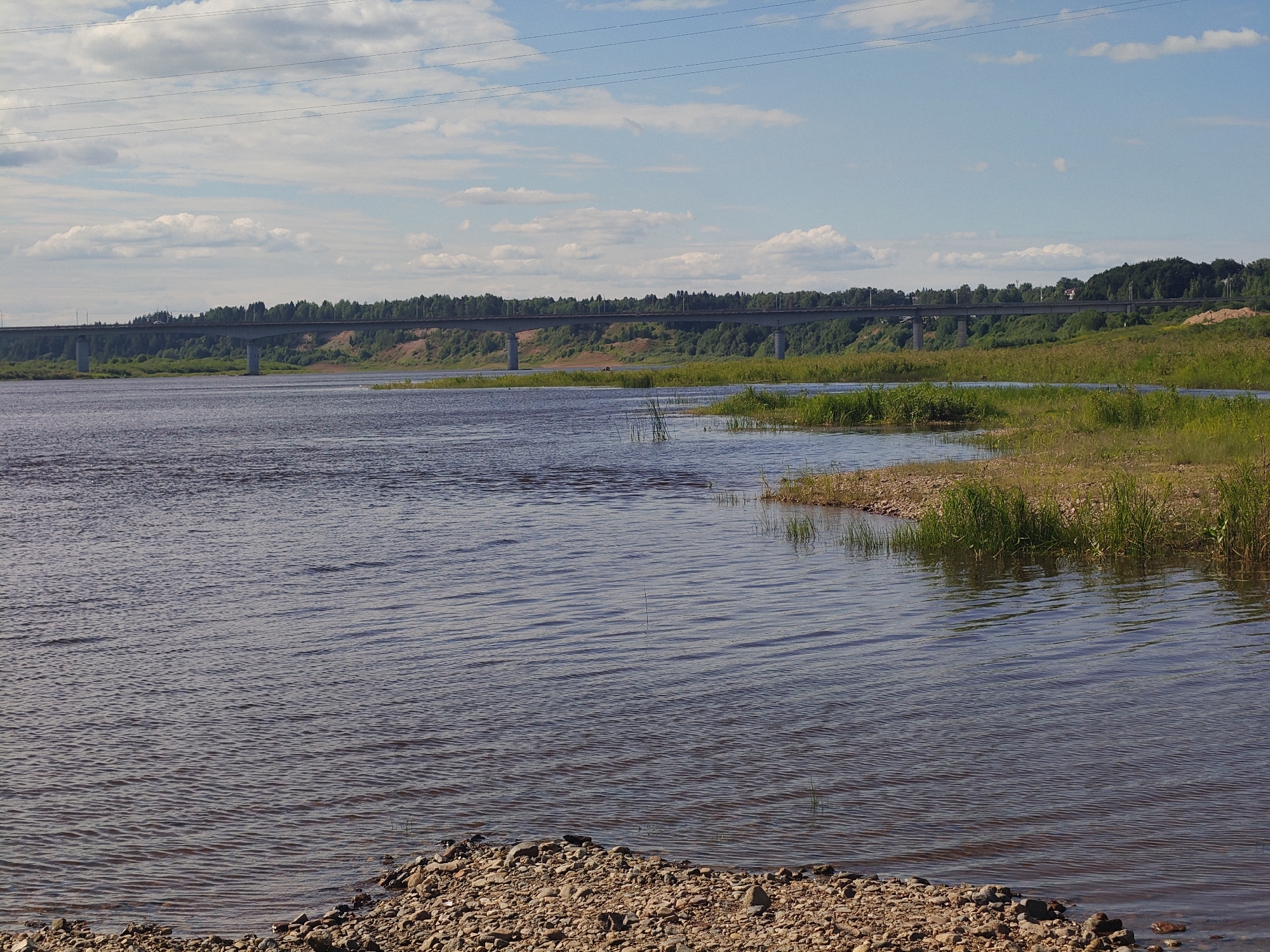 Calm river and rocky shoreline near Velikiy Ustyug, Russia