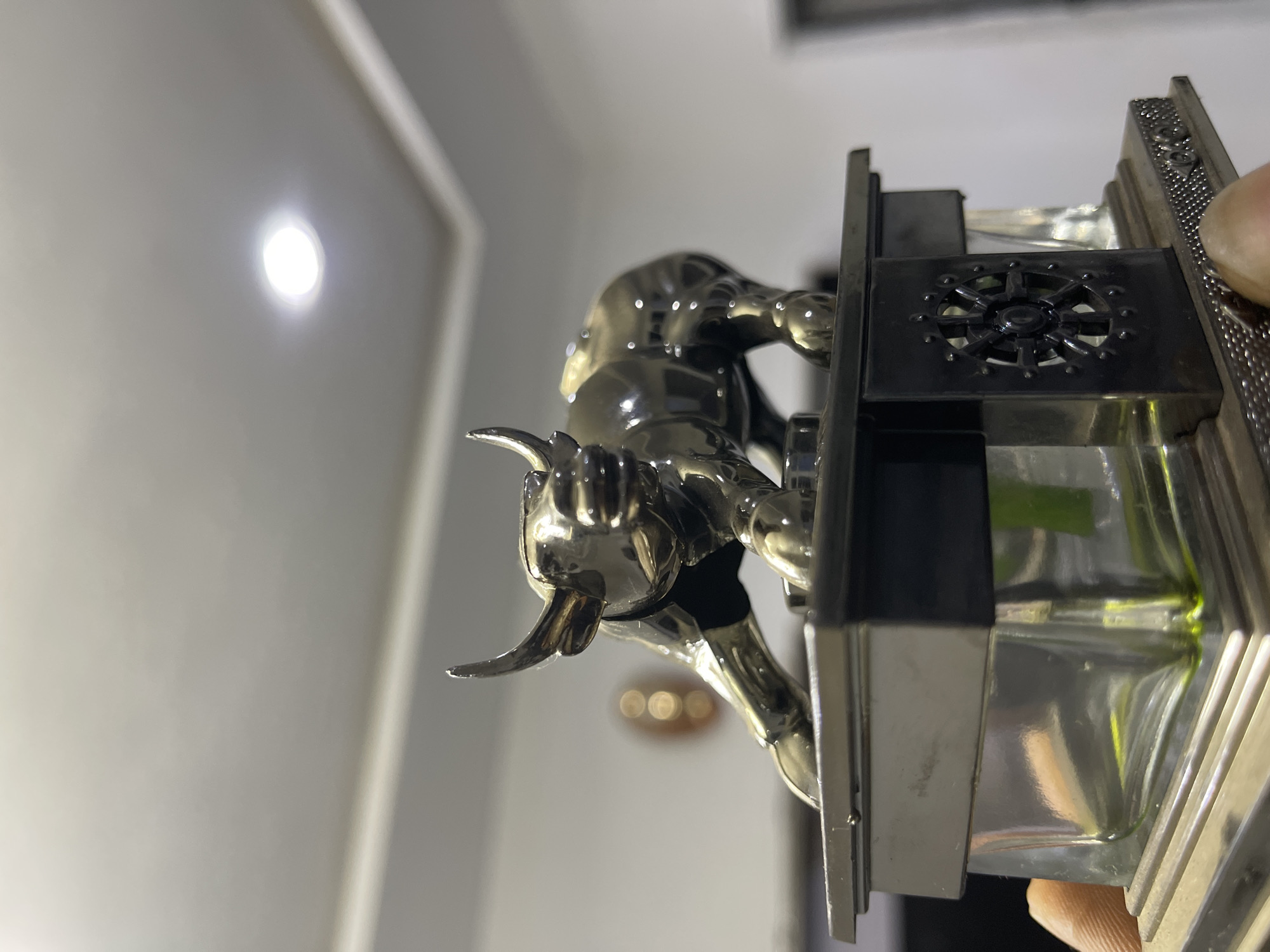 Charging bull figurine on decorative pedestal, Abuja
