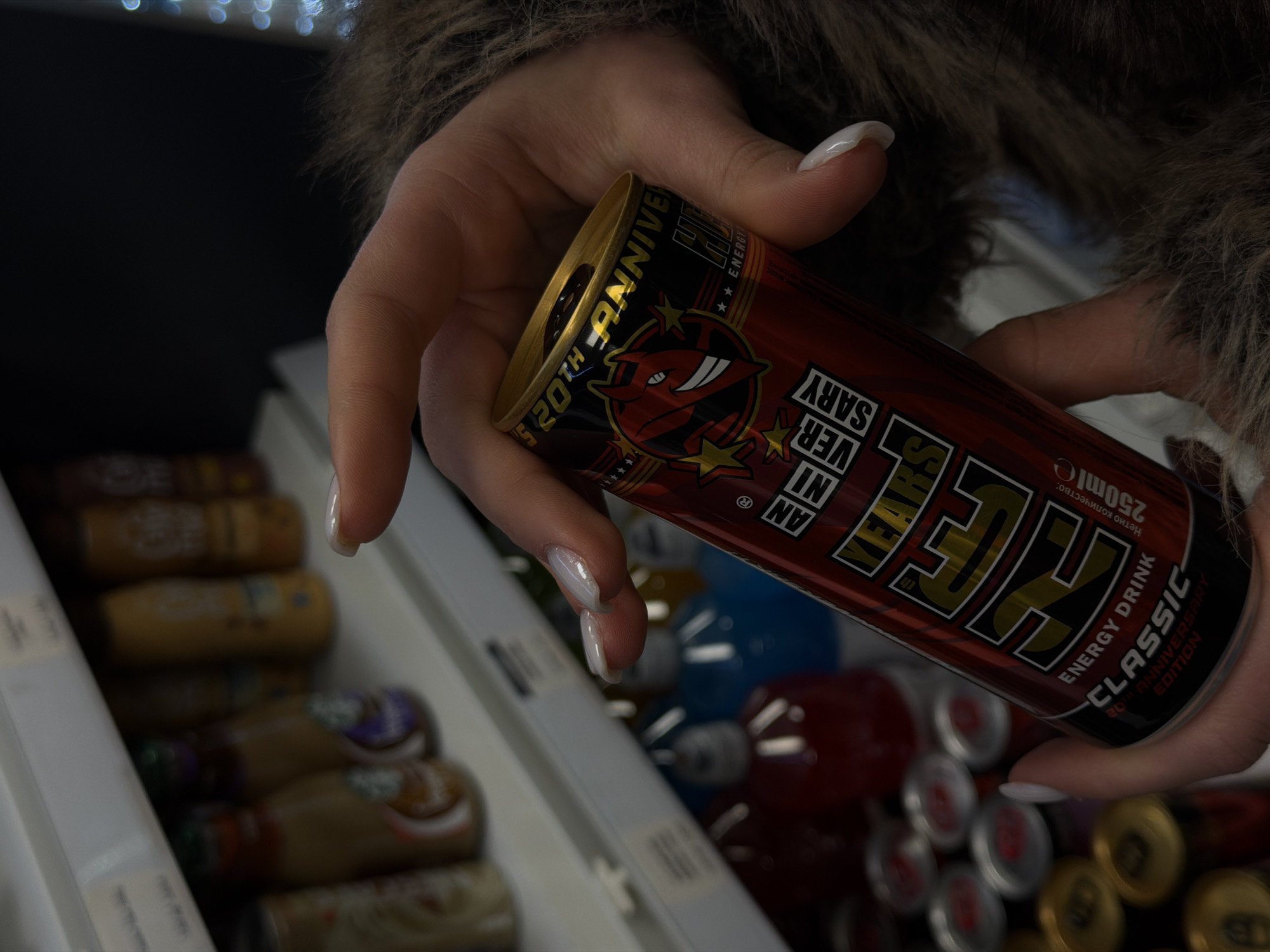 Person holds anniversary energy drink in Sofia store