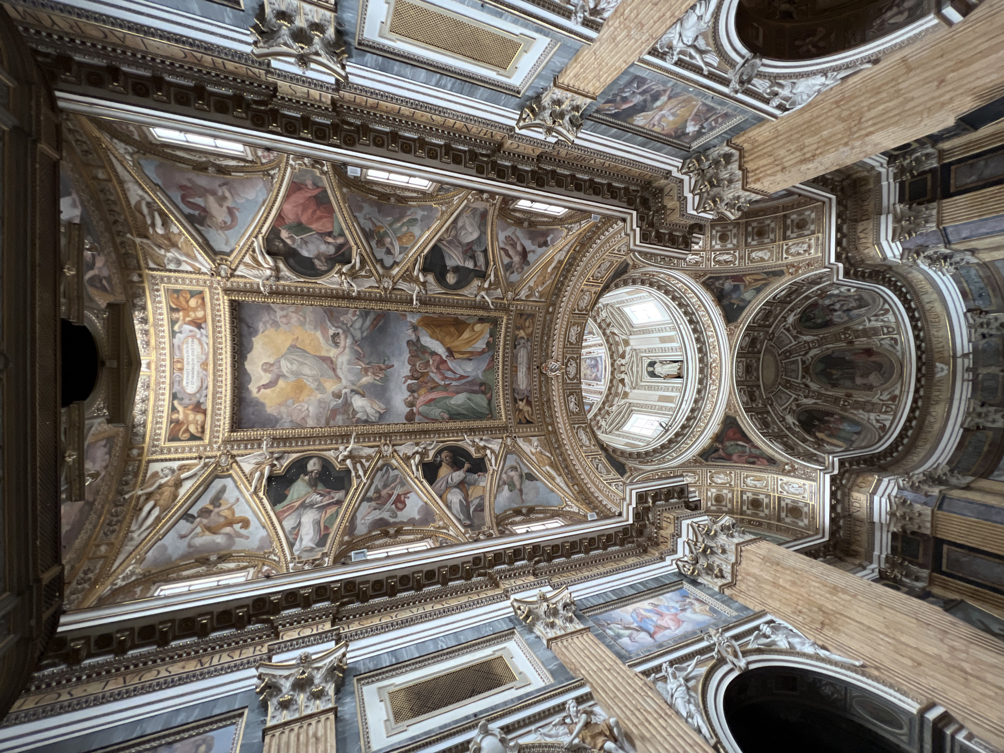 Tourist documents ornate Roman basilica architecture during afternoon visit