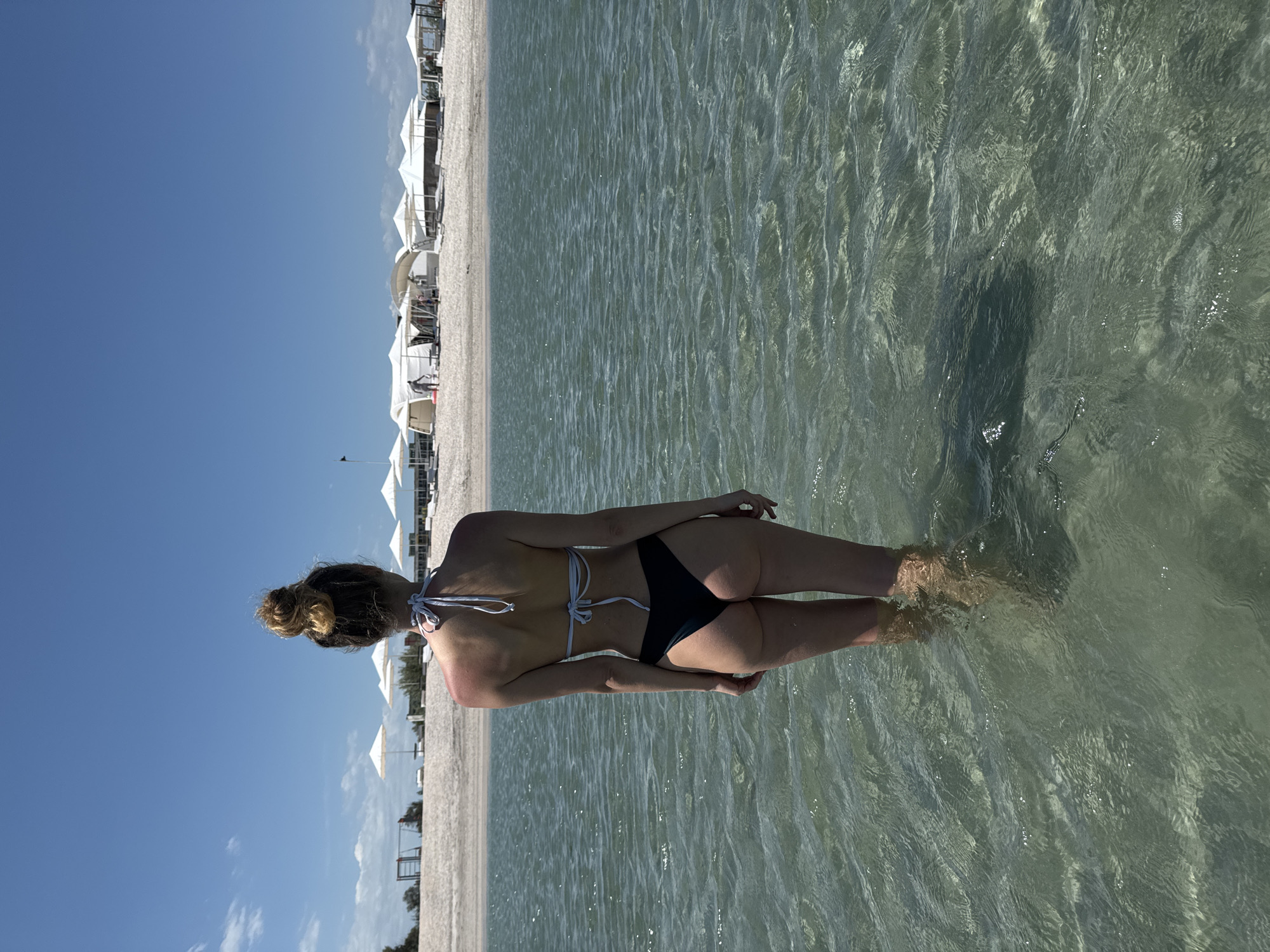 Woman wades in shallow water at Ukrainian beach