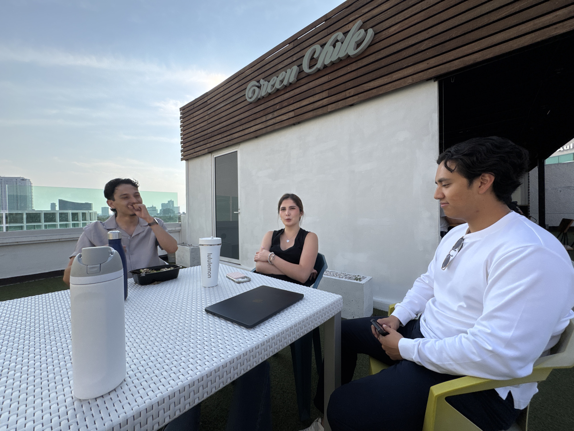 Friends gather for rooftop meal in Puebla, Mexico