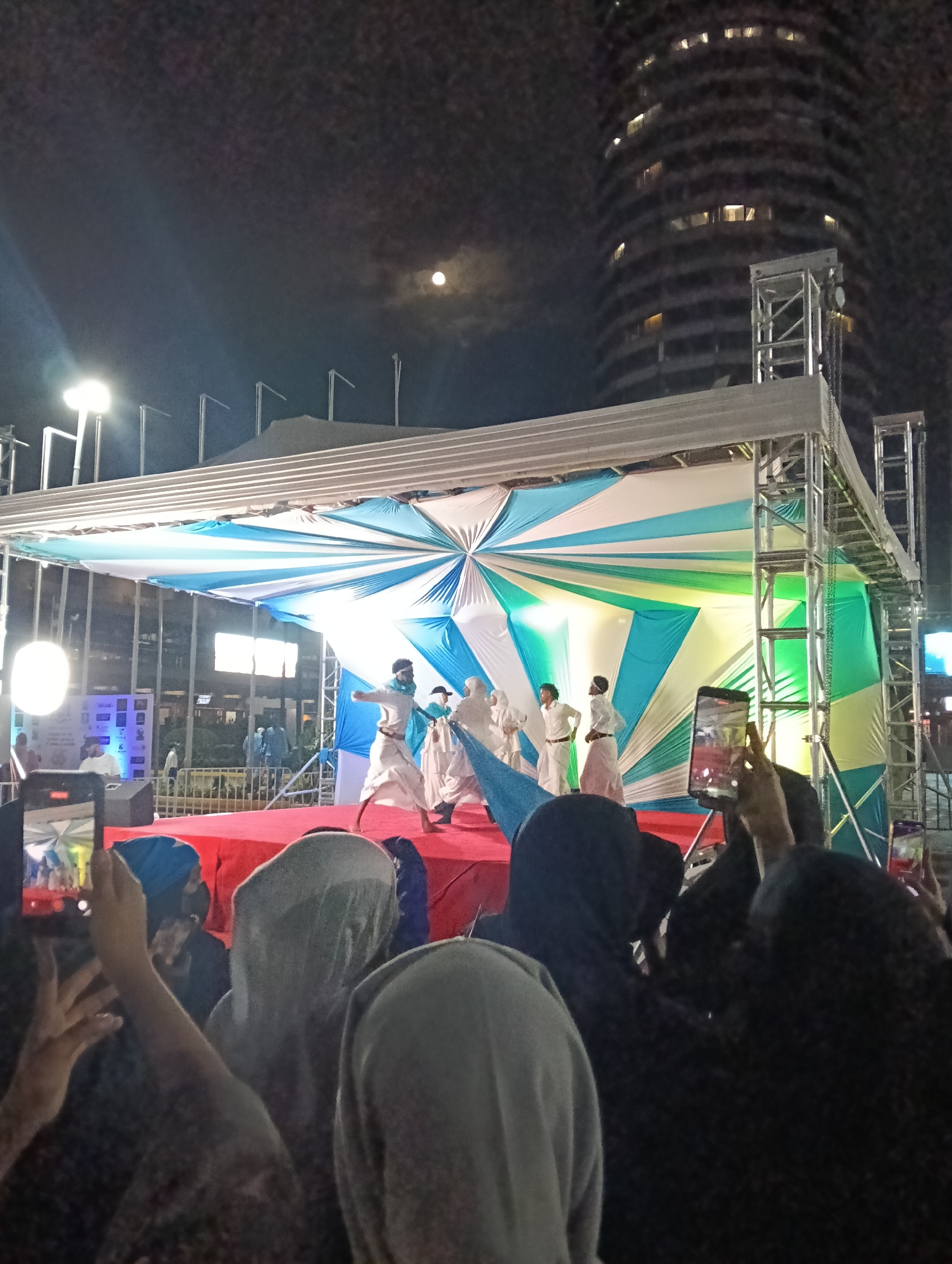 Cultural performances and crowds at a Nairobi nighttime event