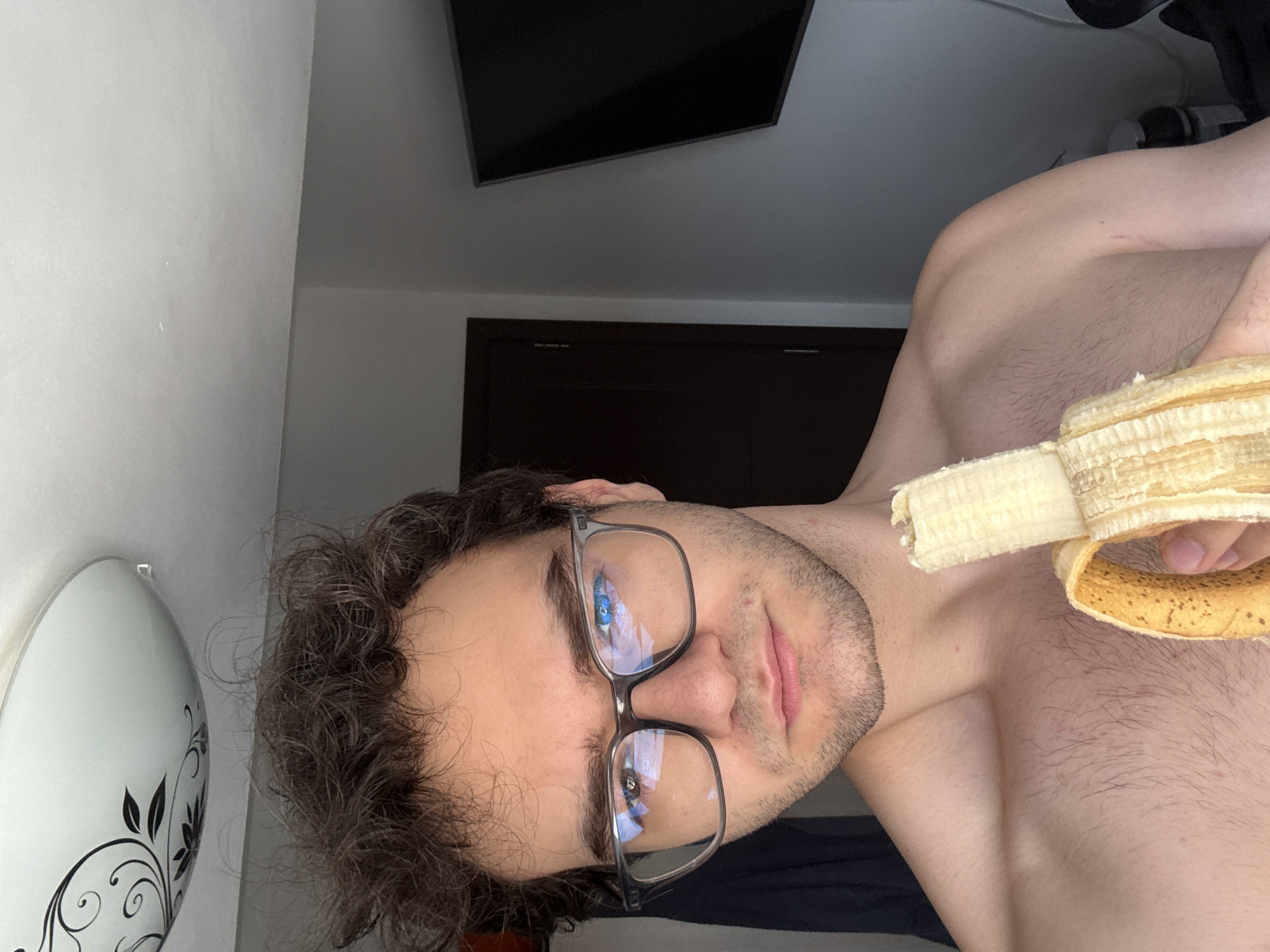 Person prepares creatine supplement and banana snack in Bulgaria