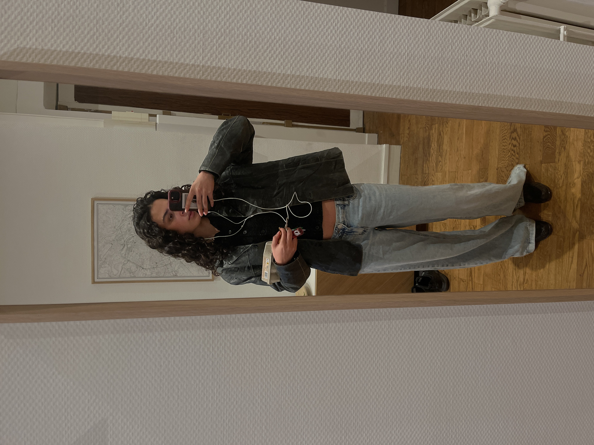 Young person takes mirror selfies in Lyon apartment