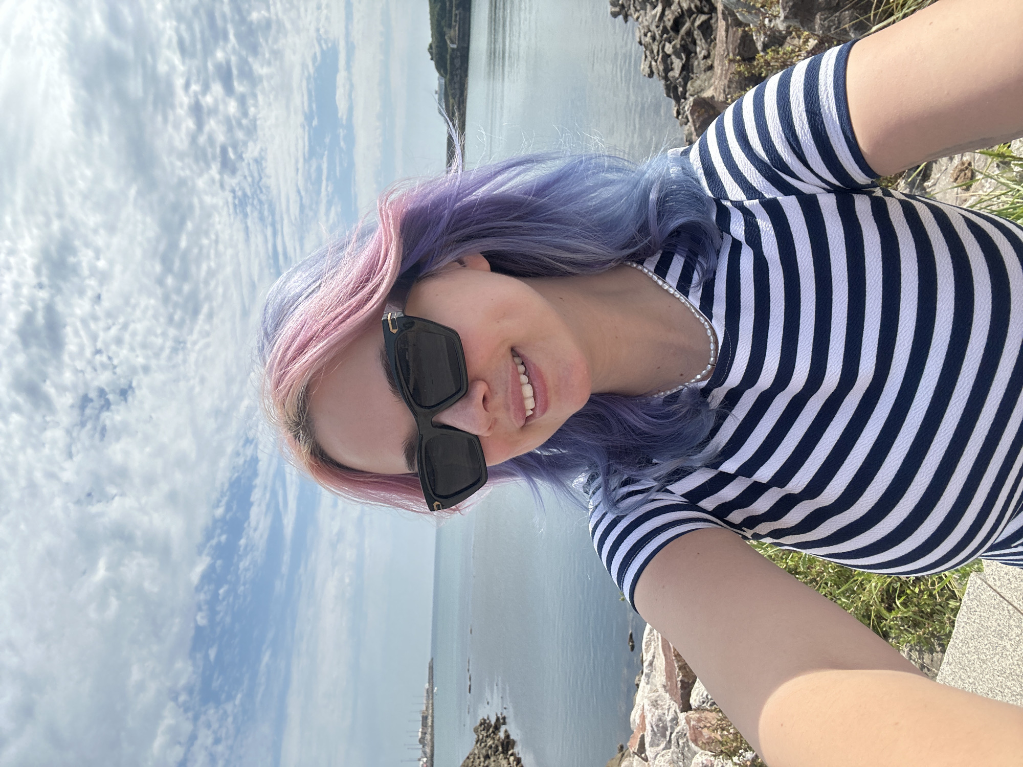 Colorful hair selfie session with dog on Gijón ledge