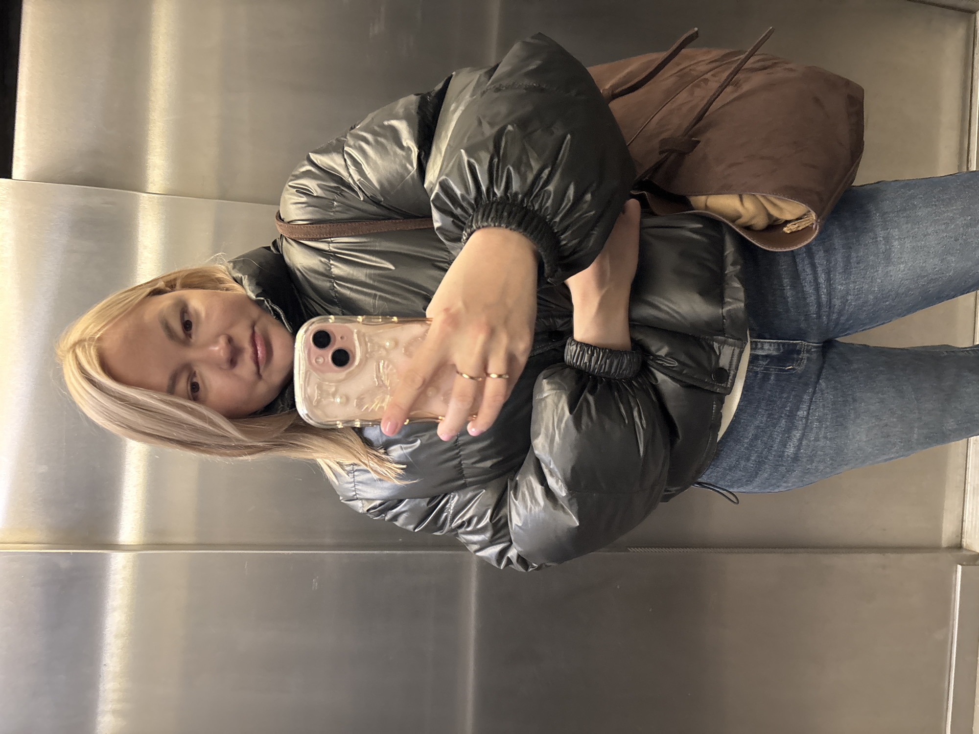 Woman takes selfie in elevator in Izhevsk