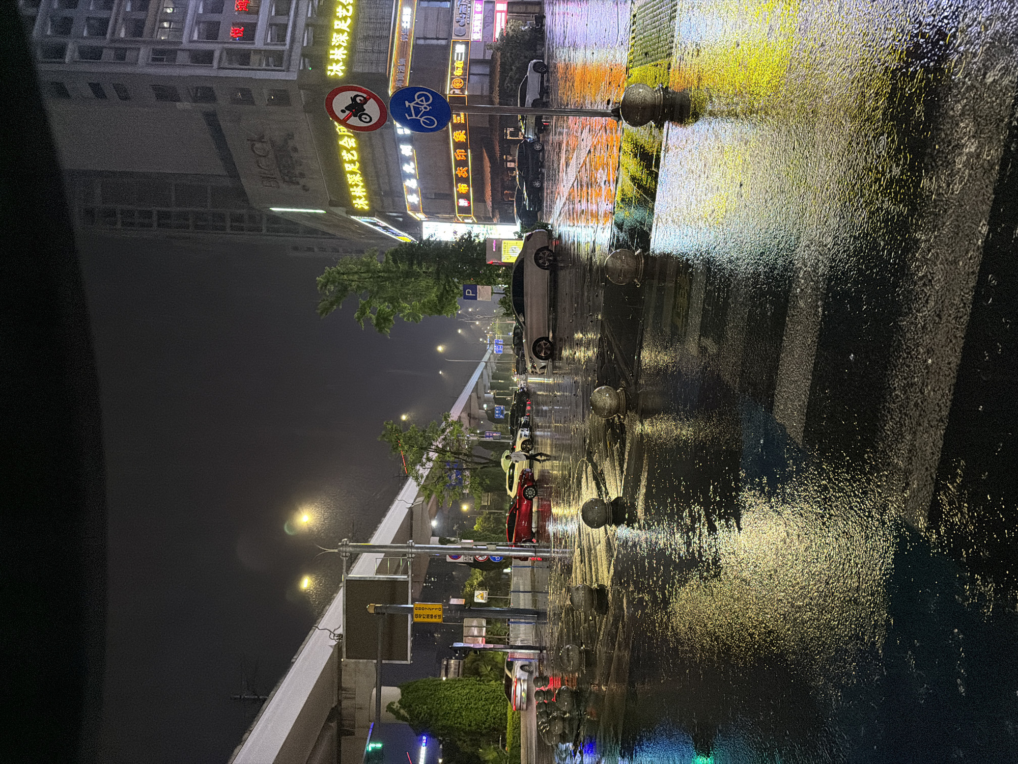 Rain creates reflective night scene in Chongqing High-tech Zone