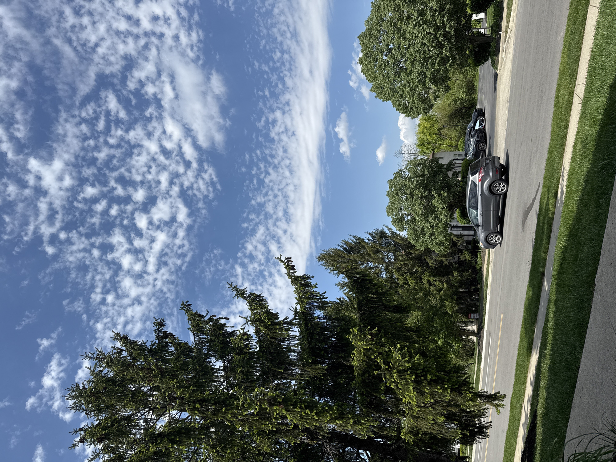 Clear skies, white clouds observed over Columbus residential area