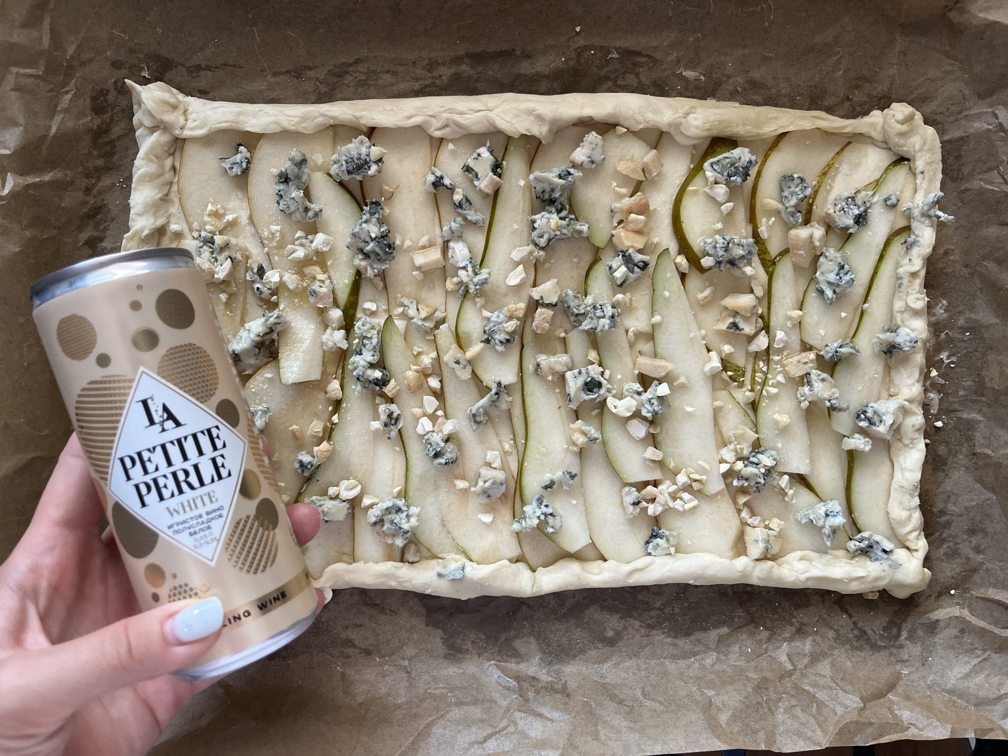 Home baker prepares pear blue cheese tart in Shushary