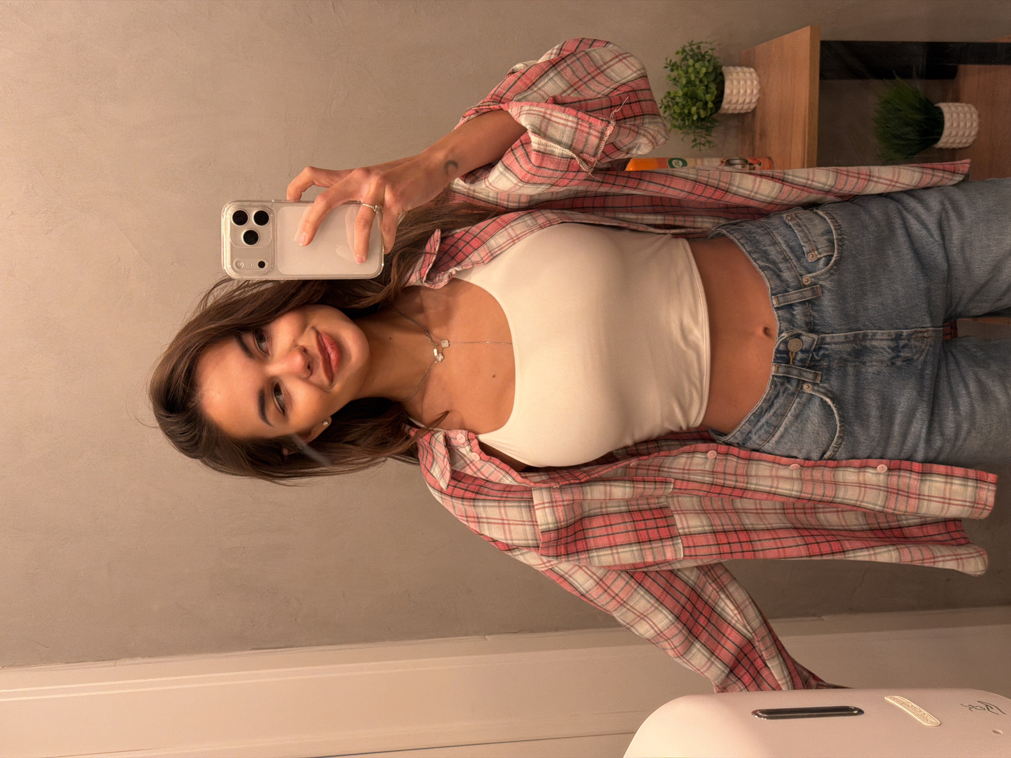 Woman takes mirror selfie in Krasnoyarsk apartment