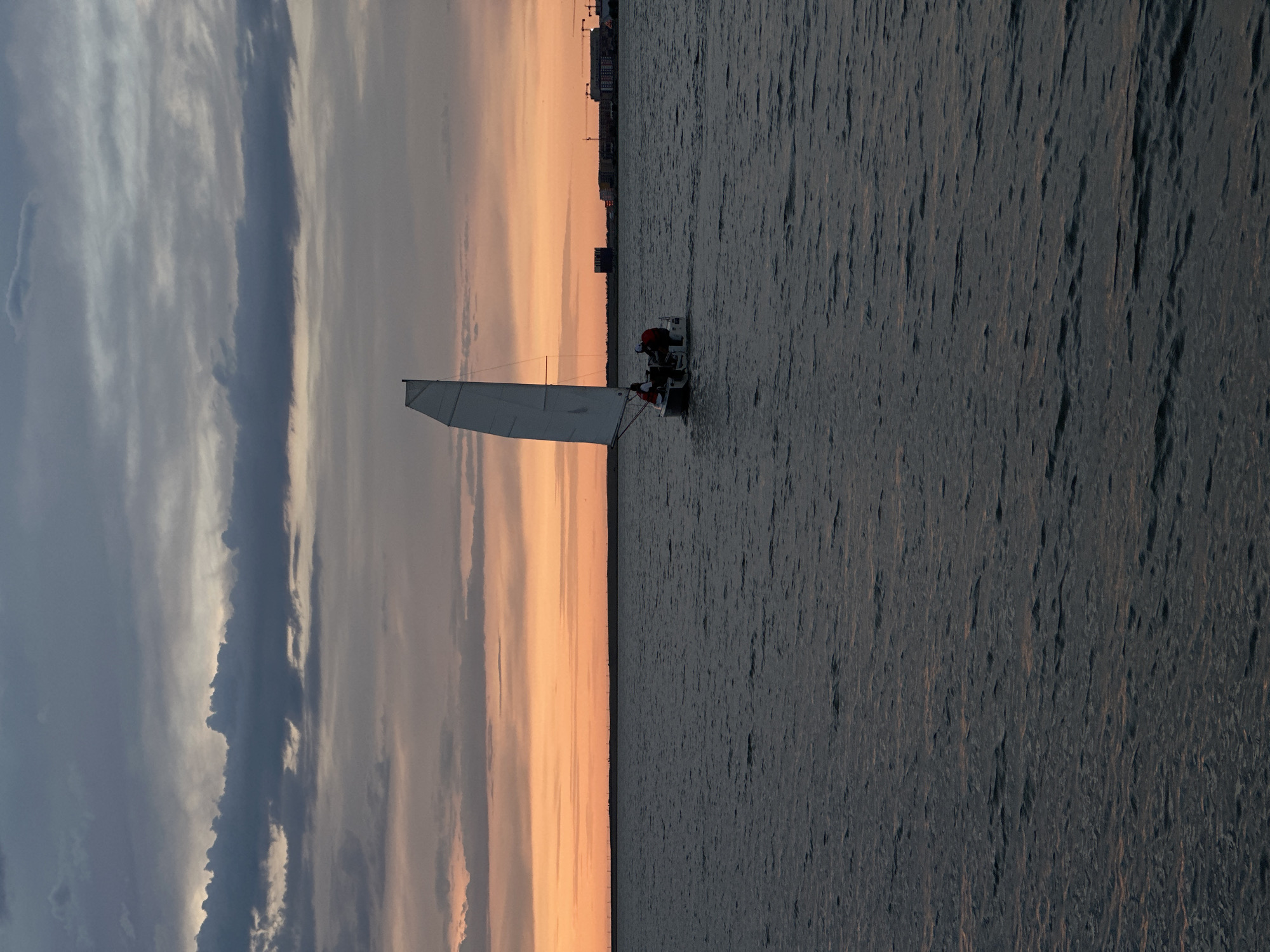 Sunset sailboat scene documented over Kokshetau waters