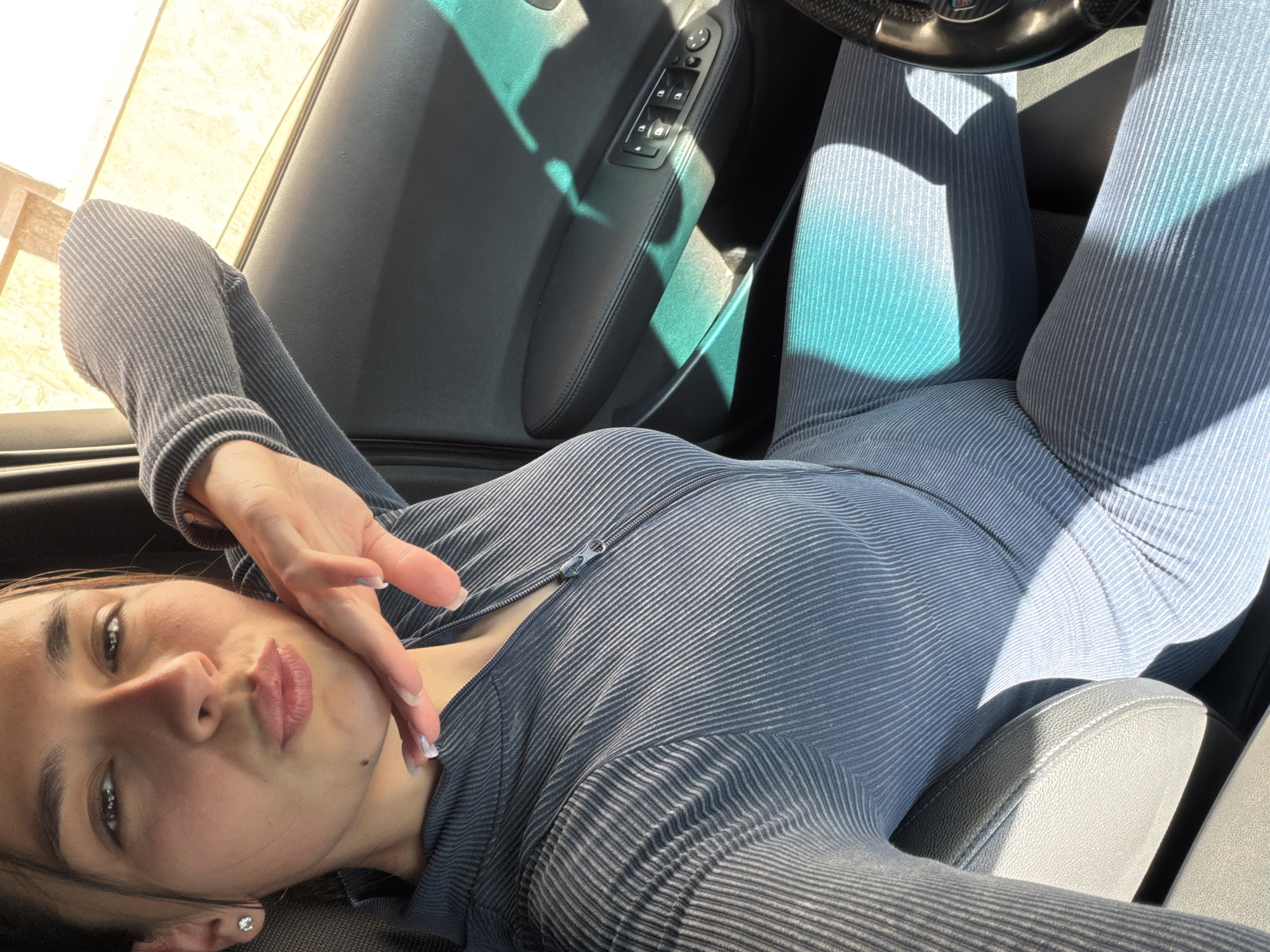 Woman takes selfies in bathroom and BMW in Gabrovo