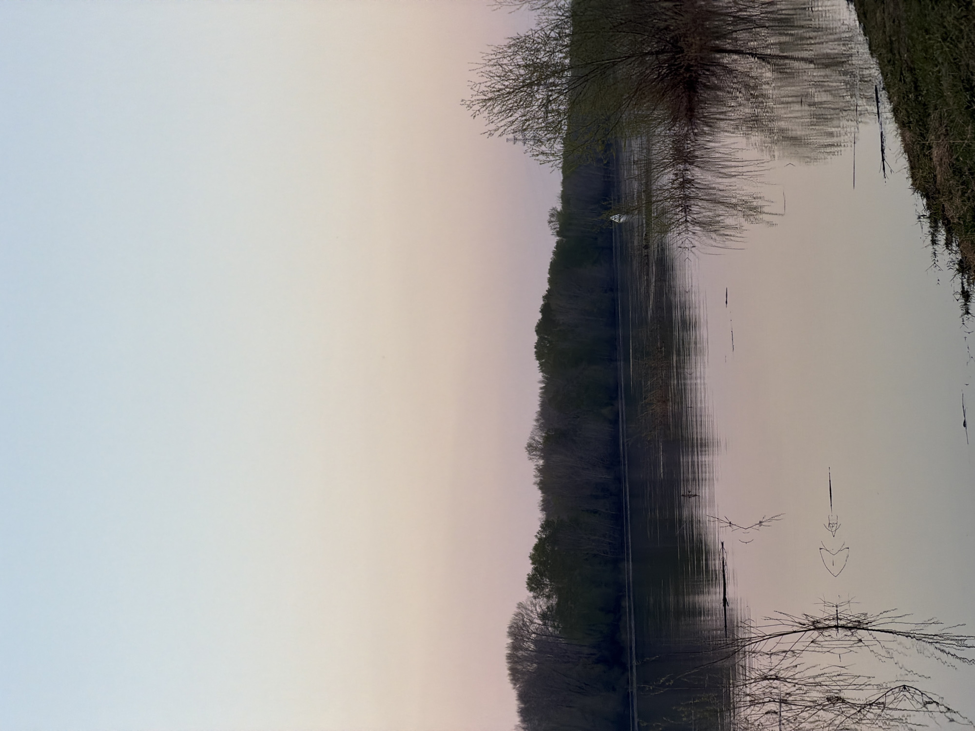 Woman documents sunset lakeside visit in Chaikovsky, Russia