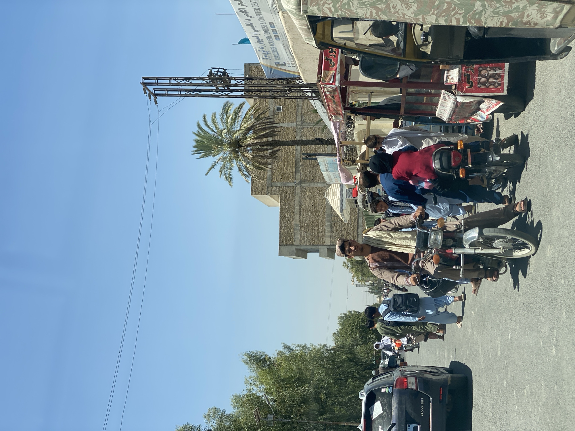 Street life in motion across central Kandahar