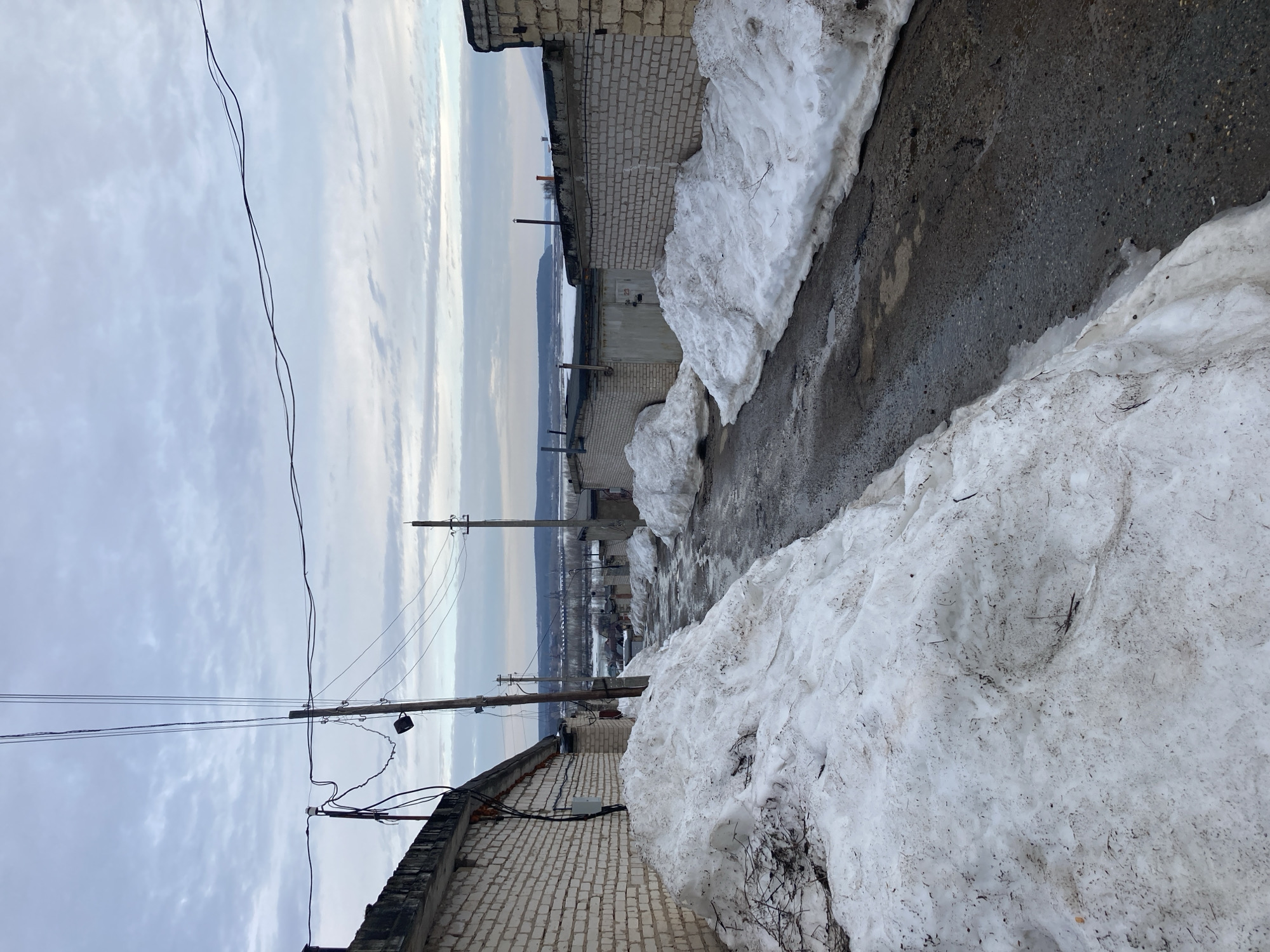 Spring snowmelt creates slushy conditions in Chaikovsky alleyway